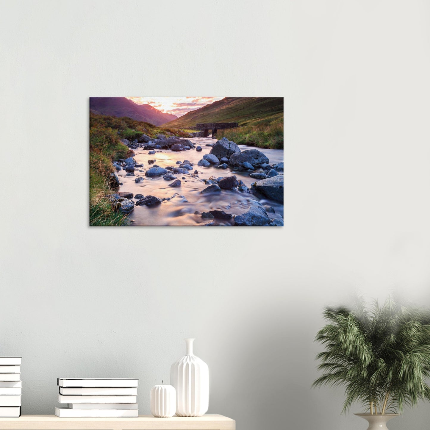 Honister Pass canvas featuring a serene valley lit by warm sunset light, with a winding stream and heritage stone bridge.