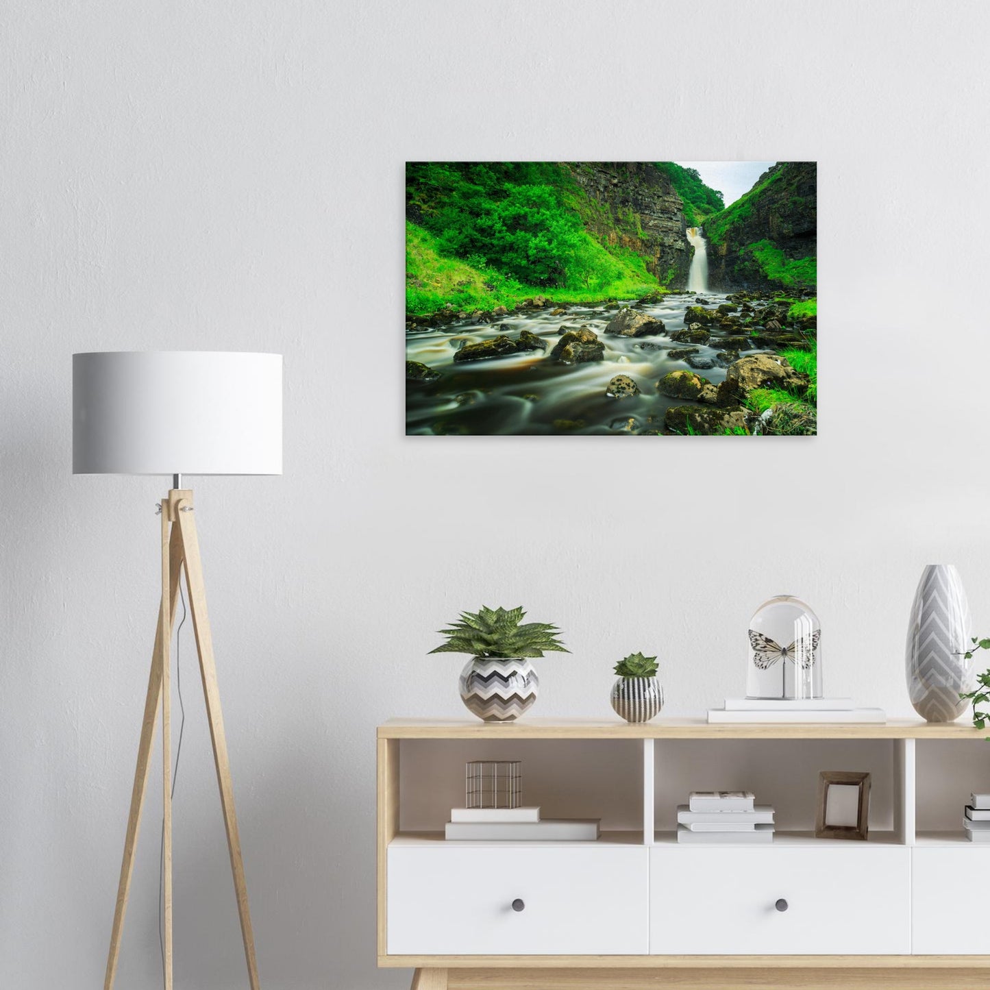 Lealt Falls waterfall canvas featuring smooth flowing water and rugged rocky edges, framed by dense greenery.