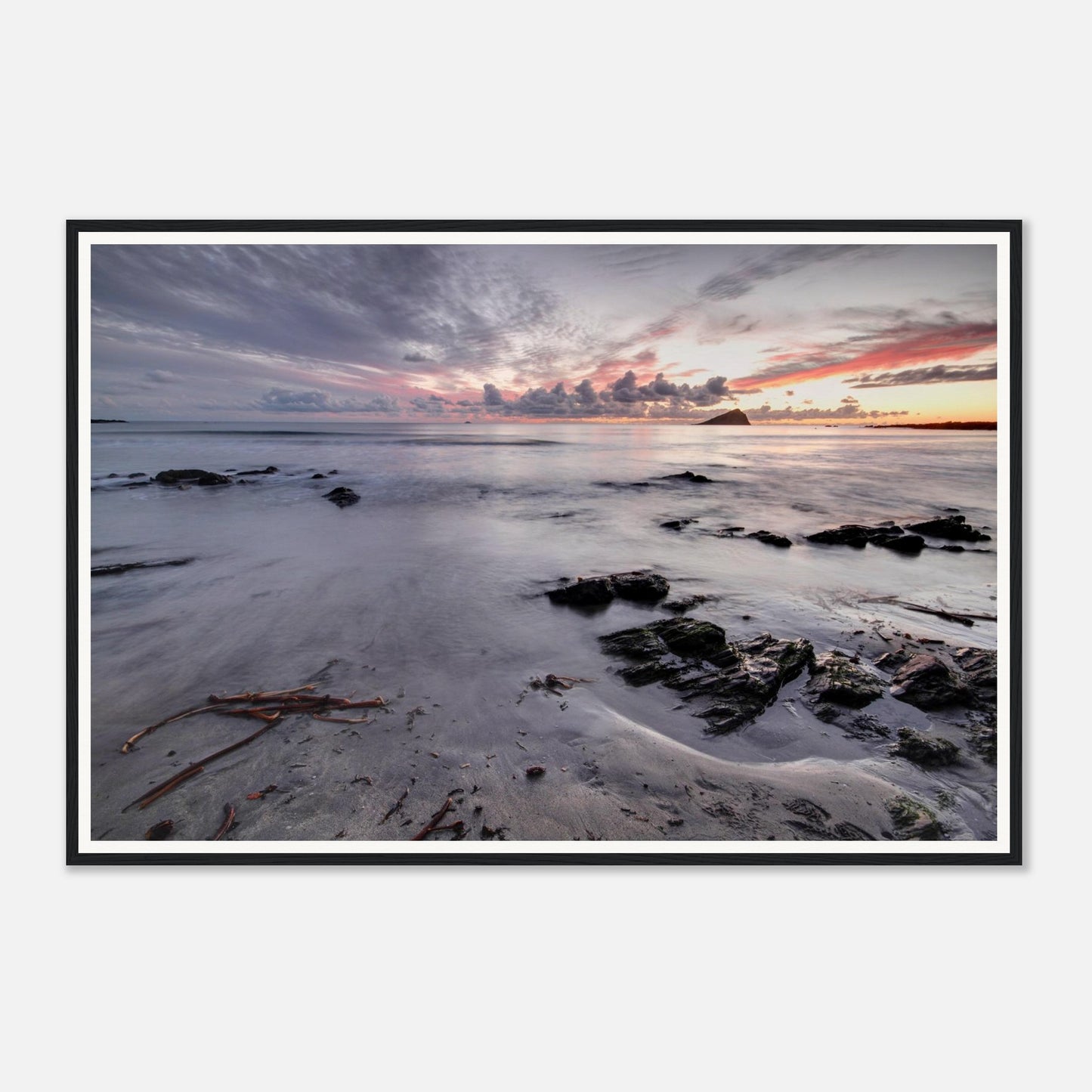 The Mewstone silhouetted on the horizon at Wembury Beach