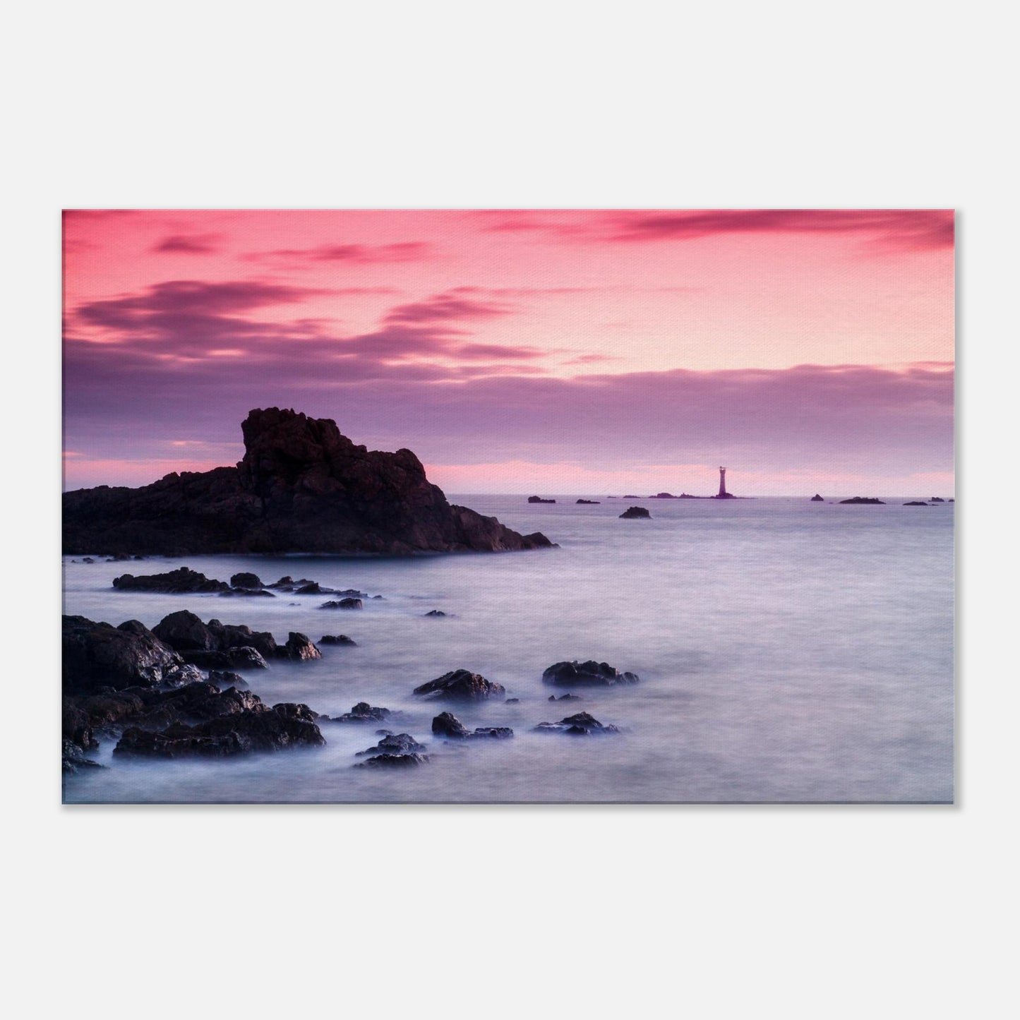 Dramatic coastal canvas of Guernsey at sunset, with Les Hanois Lighthouse and a sea washed in pinks and purples.