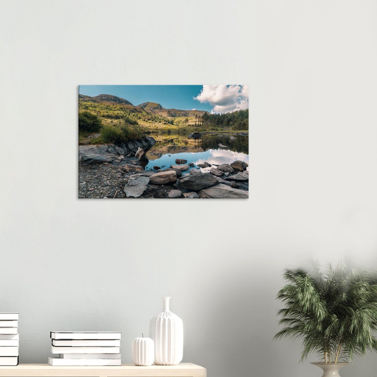 Canvas print of Llyn Llywelyn with distant mountains and calm sky