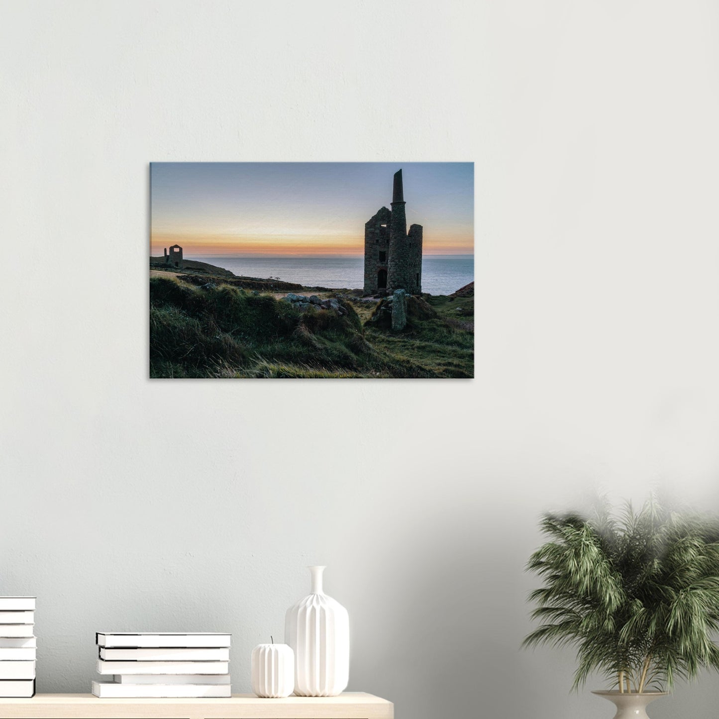 Abandoned Wheal Owles mine against the vibrant colours of a Cornish coastal sunset
