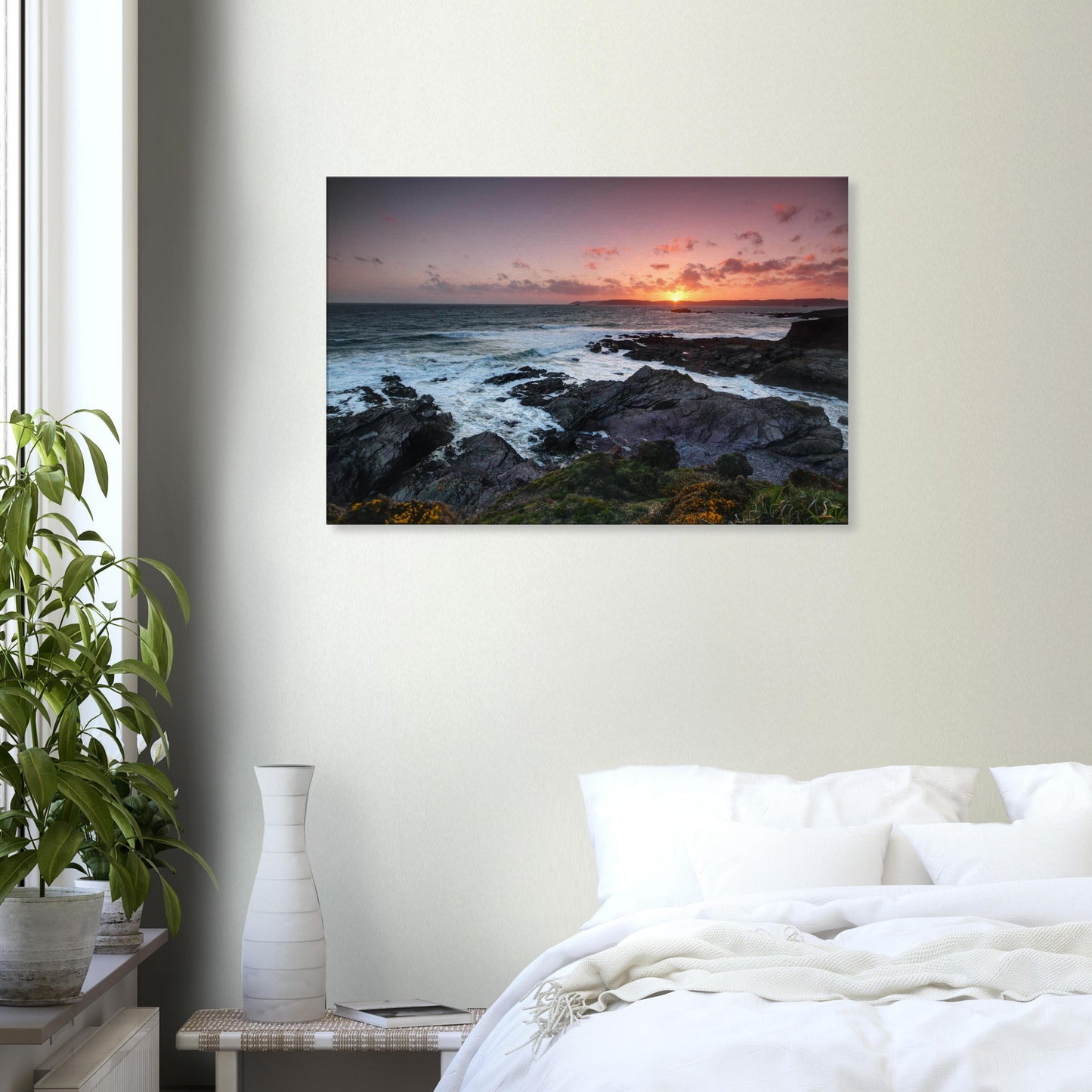 Coastal sunset canvas of Heybrook Bay with golden light, churning sea, and delicate wildflowers gently swaying on the cliffs.