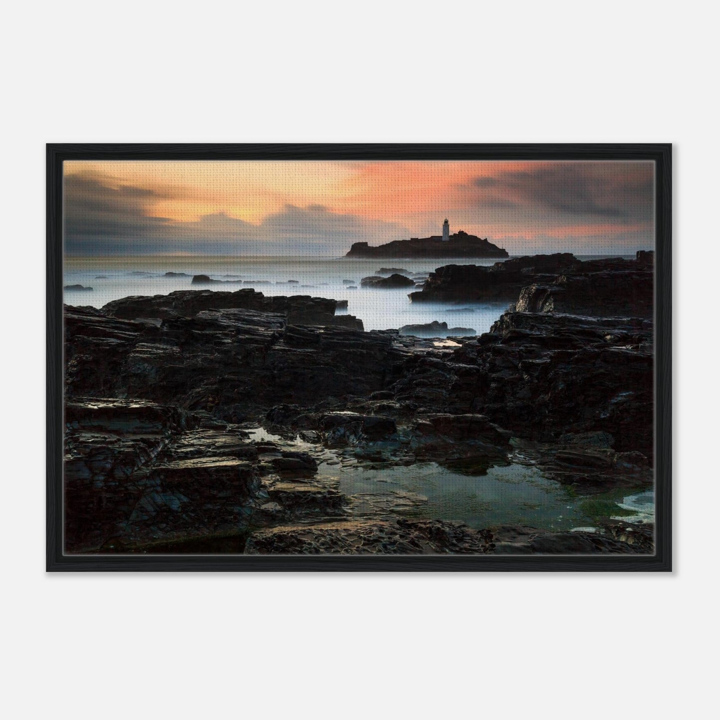 Sunset glow over Godrevy Lighthouse and rugged coastline in print