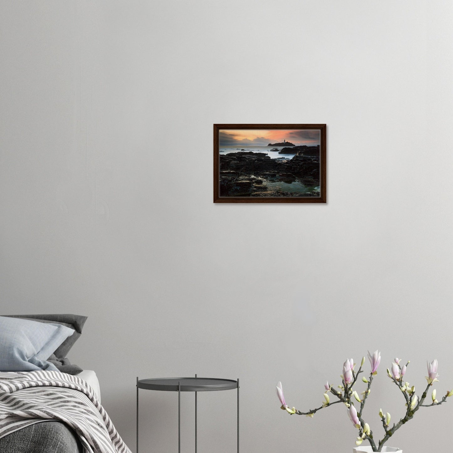 Warm hues over rocky coast and lighthouse in Cornwall artwork