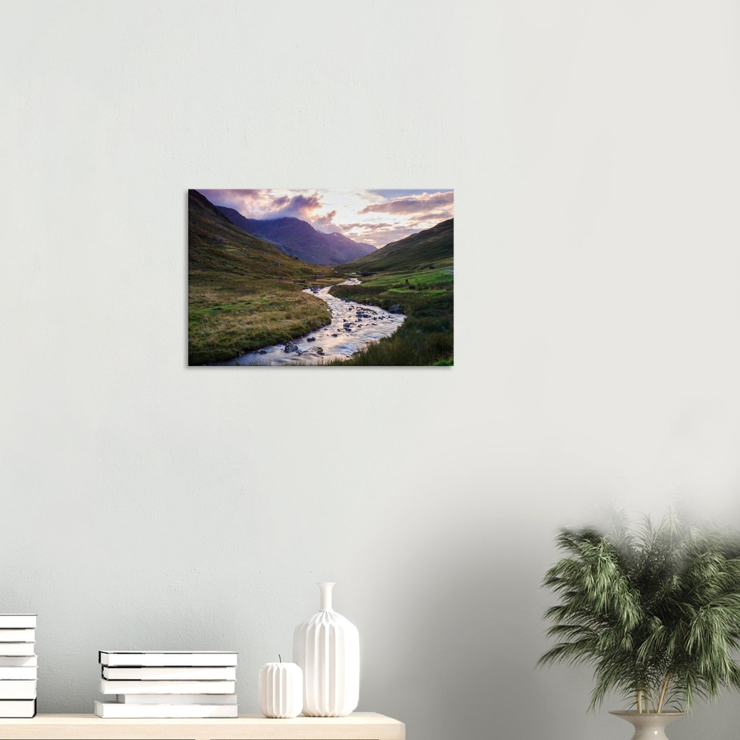 Honister Pass dusk canvas showing a tranquil brook weaving through the valley, surrounded by softly lit hills and distant peaks.