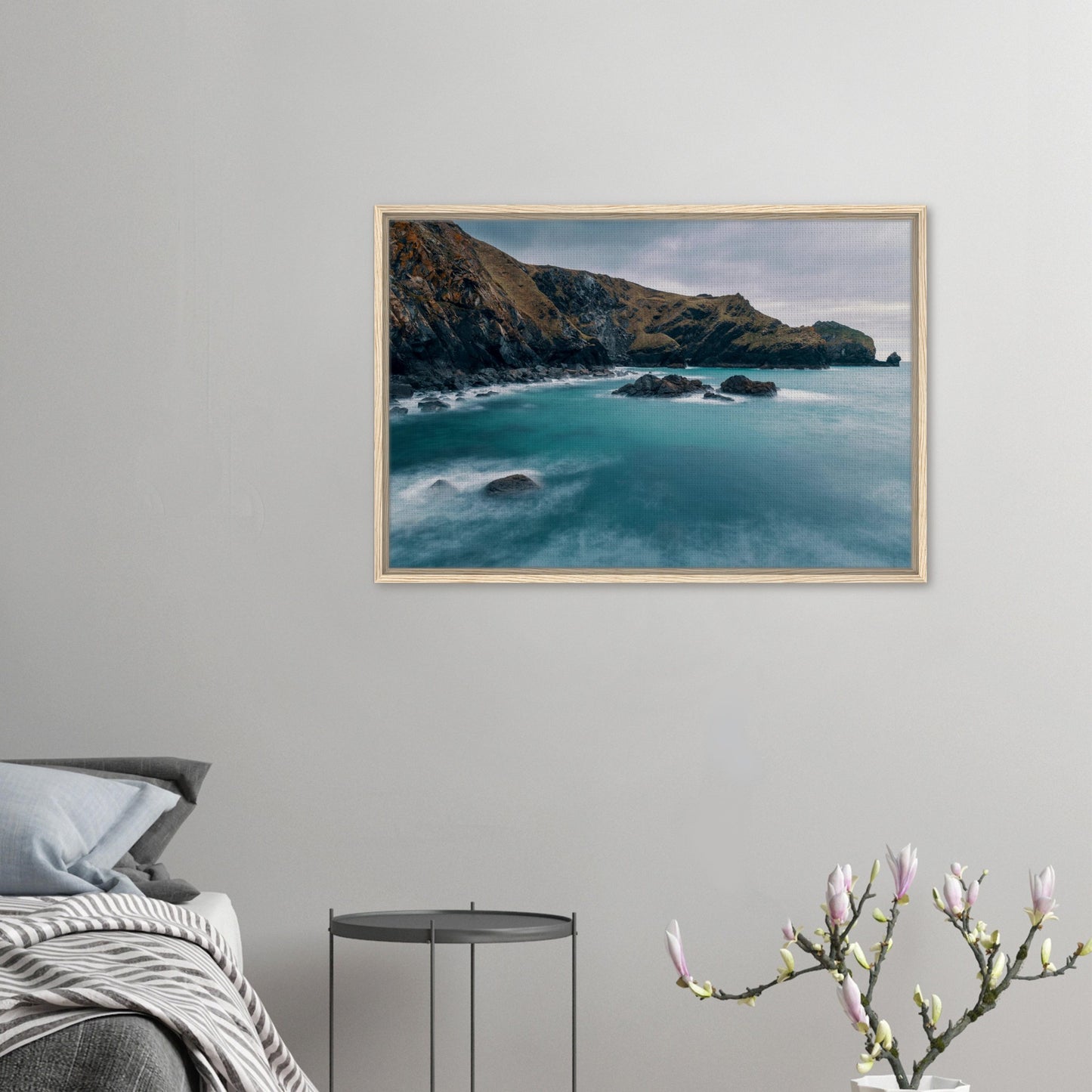 Rugged cliffs and calm sea framed canvas