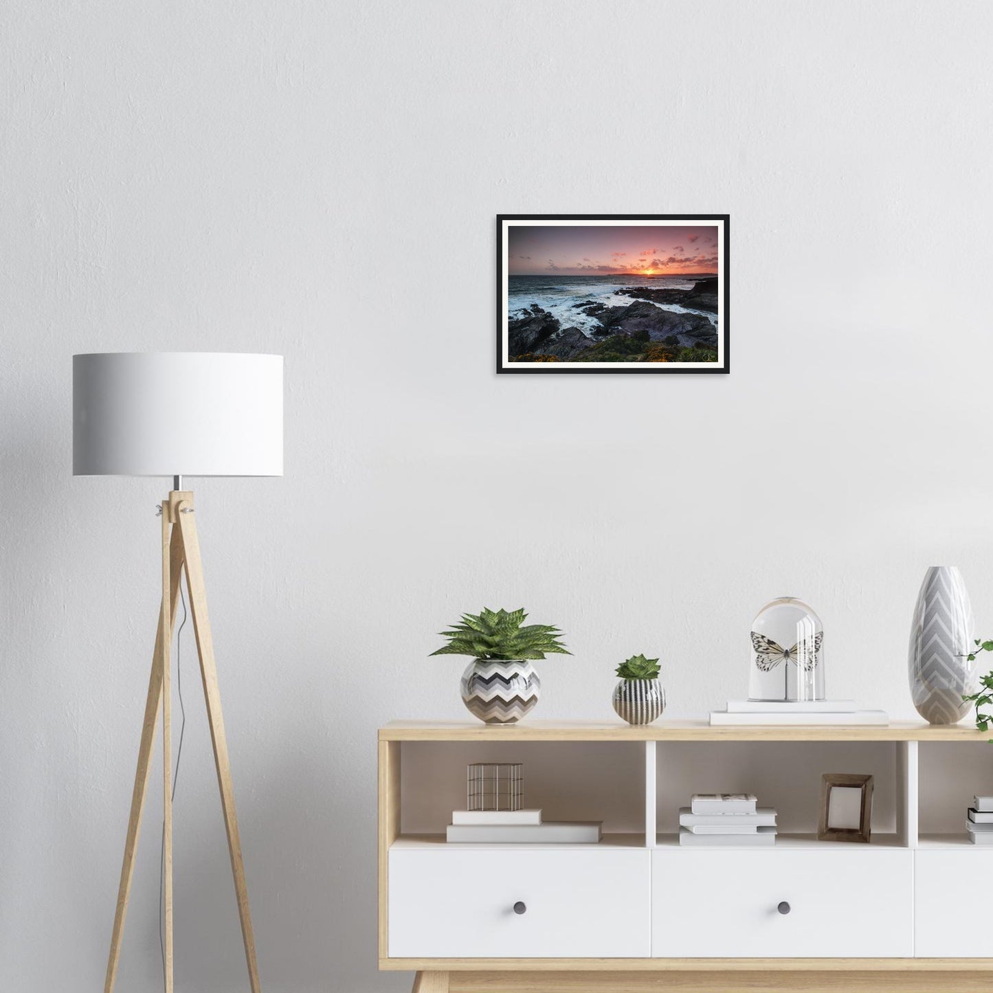 Golden light reflecting on sea at Heybrook Bay framed print