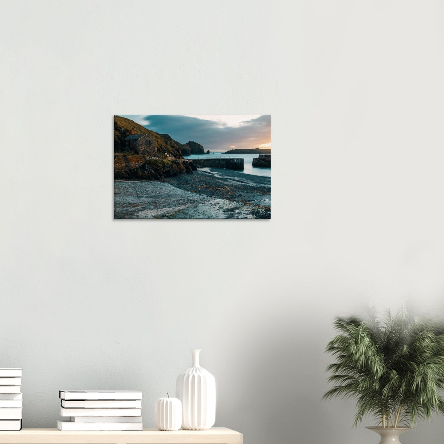 Soft pastel colours of twilight sky reflected on calm waters in Cornish harbour