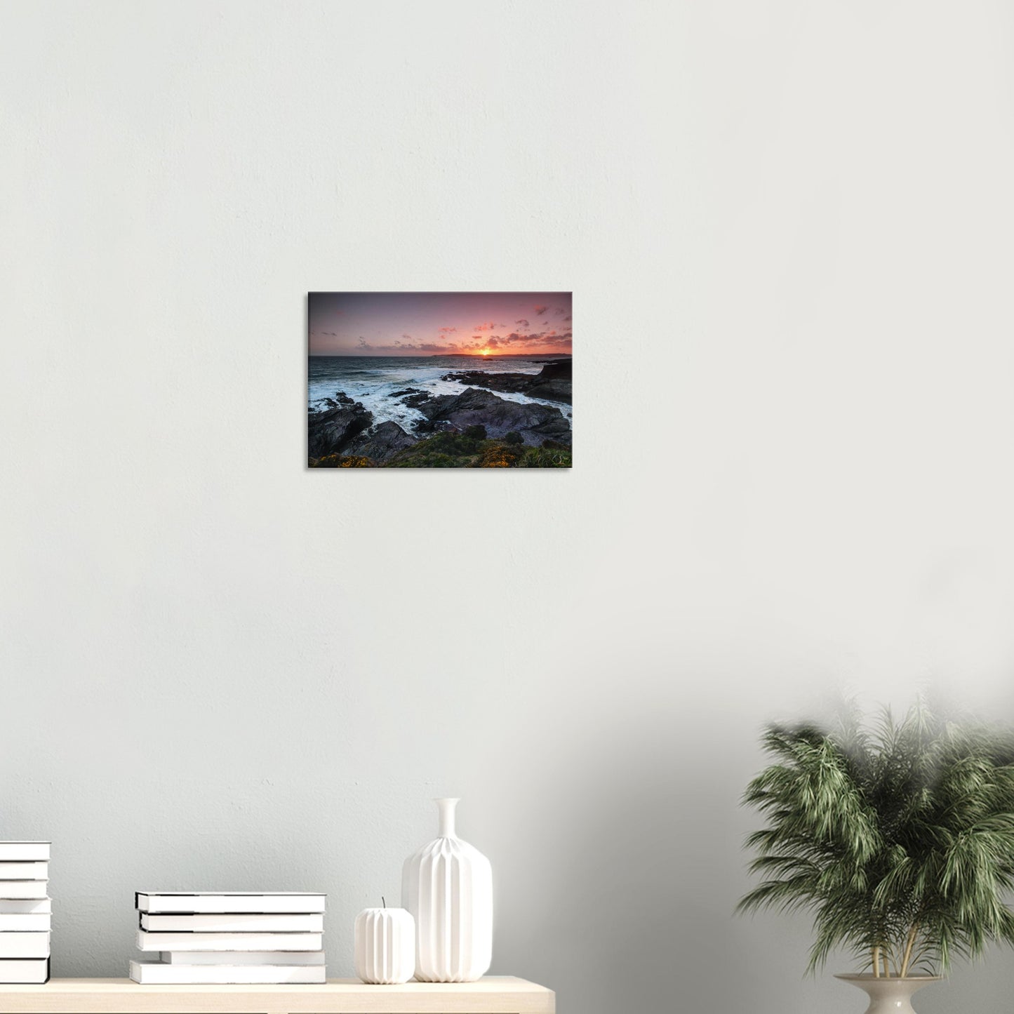 Peaceful coastal canvas of Heybrook Bay, Plymouth, featuring golden hour light, dramatic rocky shores, and sea breeze-ruffled wildflowers.