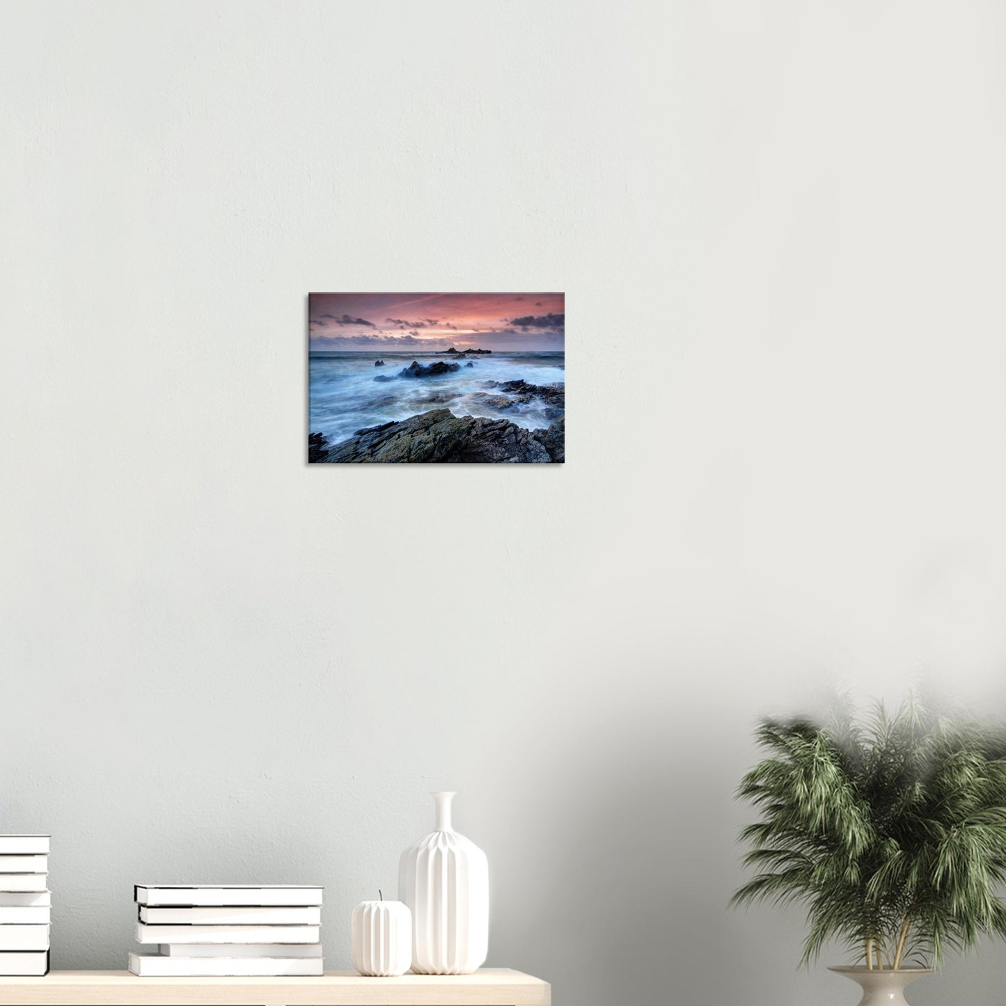 Heybrook Bay canvas print depicting swirling ocean waves around rocky coastline beneath a dramatic red and orange sunset sky.