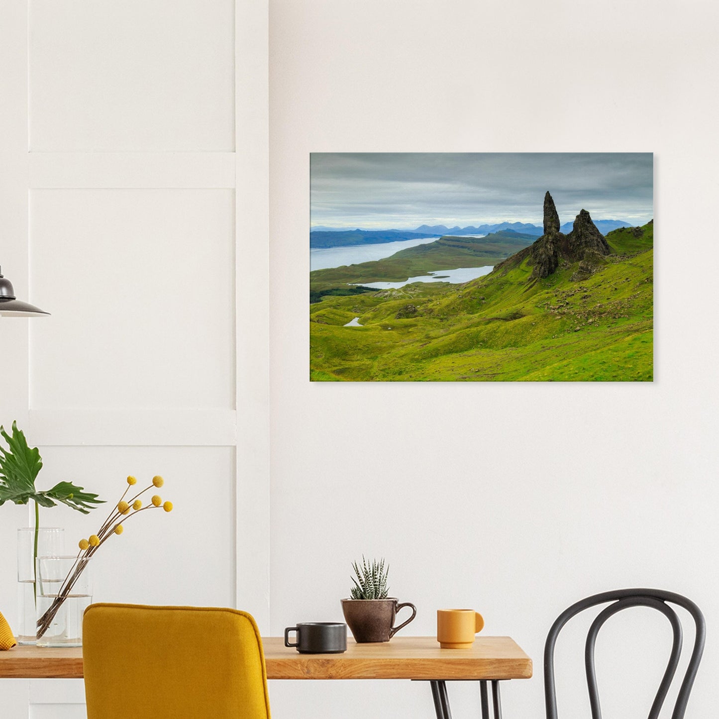 Iconic landmark The Old Man of Storr portrayed in a scenic canvas with hills, lochs, and a wild Highland backdrop.