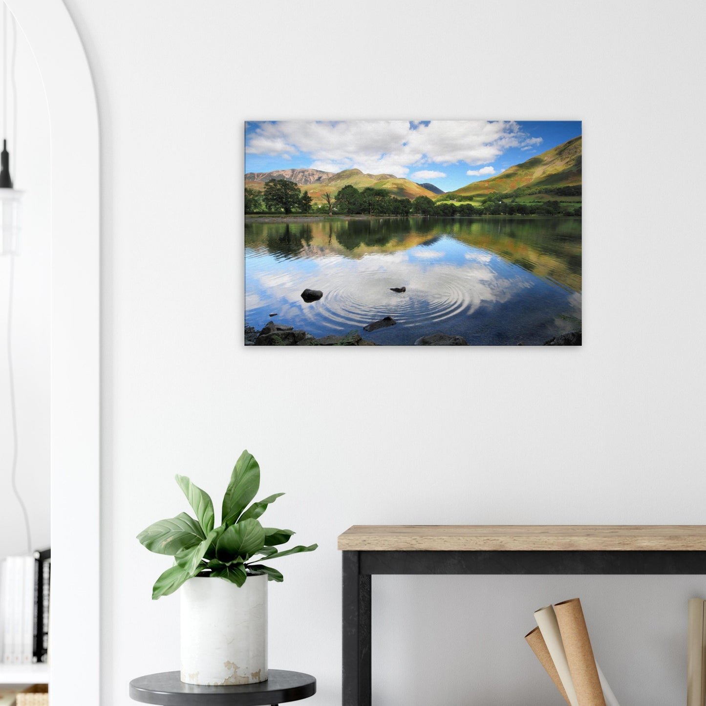 Reflective Lake District canvas print showing the play of ripple and reflection on Buttermere Lake with vibrant fells and scattered clouds.