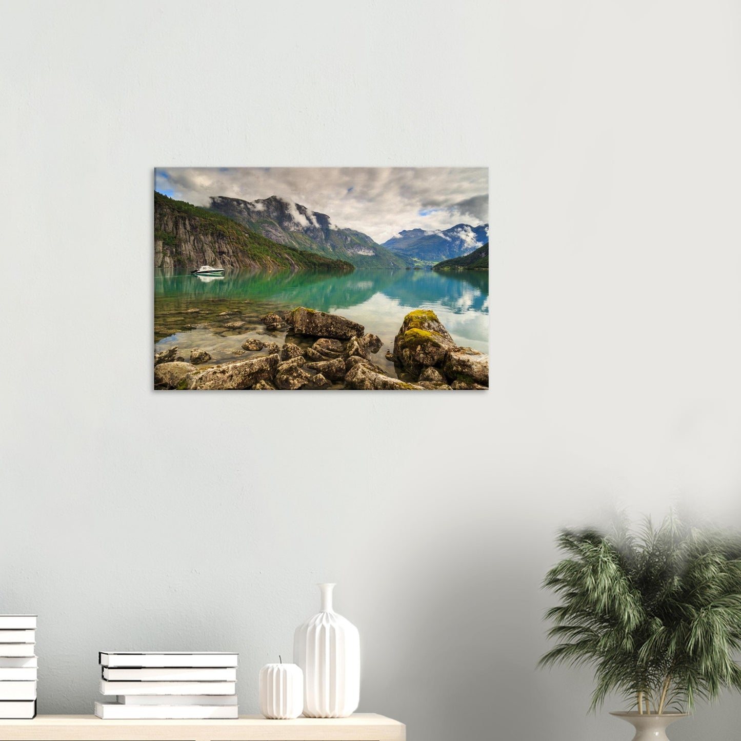 Reflective surface of Strynevatnet capturing the dramatic Nordic mountain scenery enveloped in mist