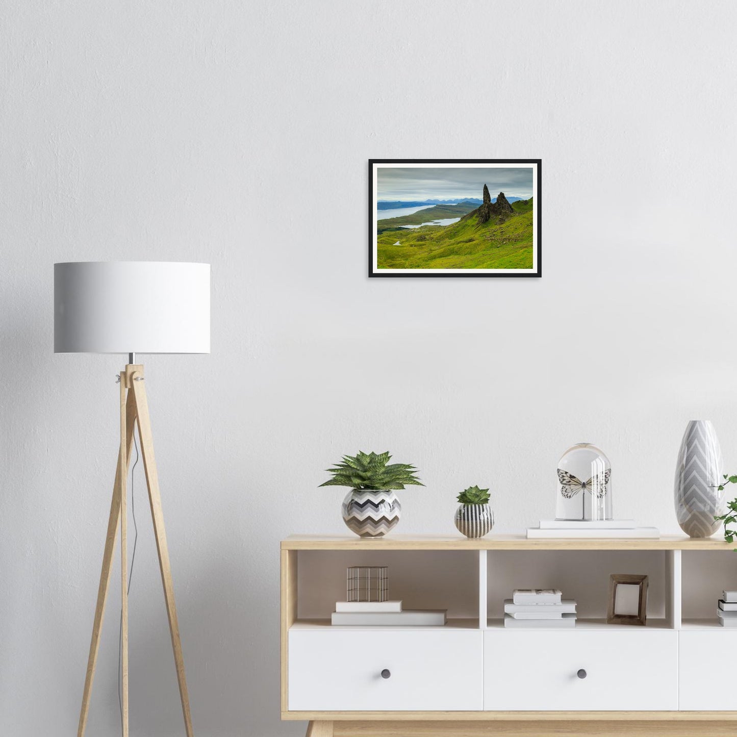 Framed print of The Old Man of Storr with lush green hills and sea