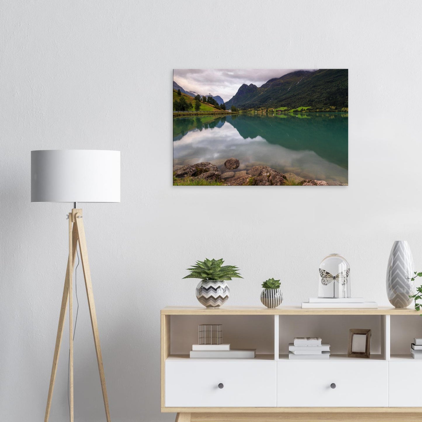 Canvas artwork featuring the quiet splendour of Lake Floen, Norway, with smooth stones on the lake’s edge and soft sky reflections.