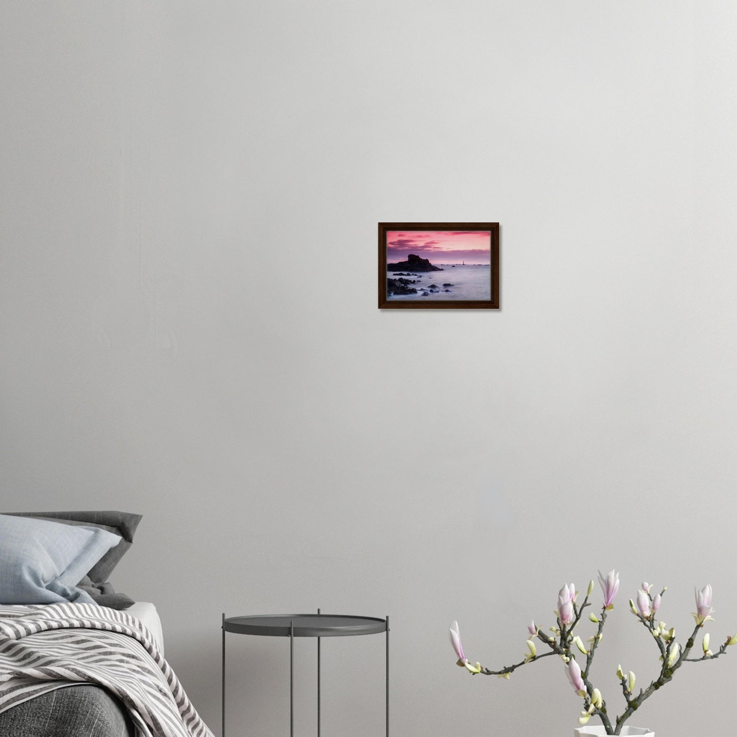 Golden hour silhouette of lighthouse in Guernsey framed canvas
