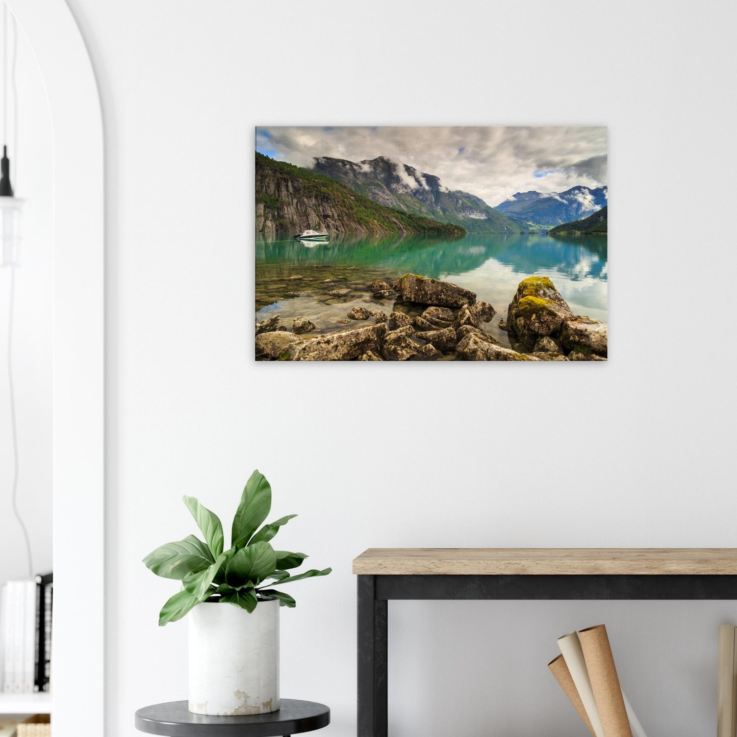 Canvas print capturing the contrast between mossy foreground rocks and smooth reflective lake