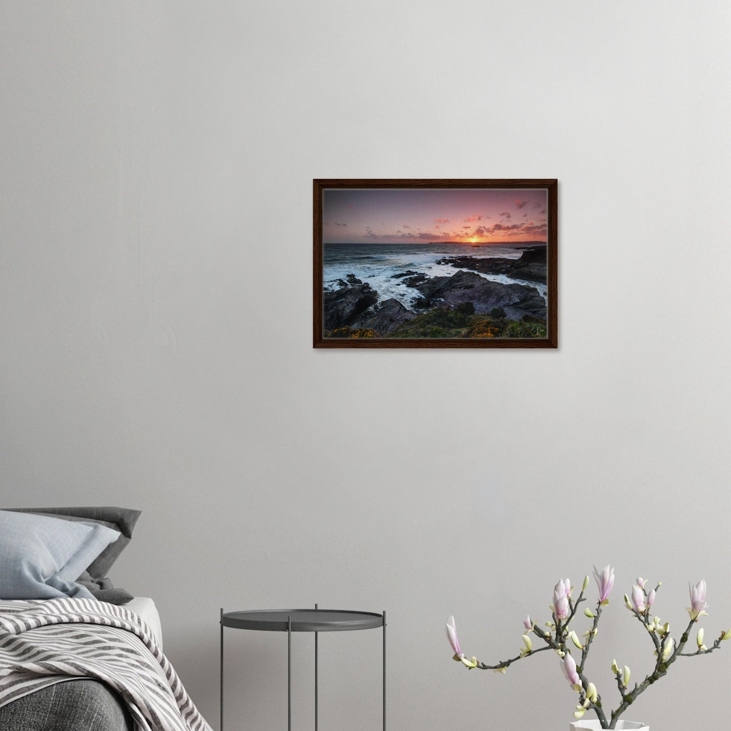 Devon sunset seascape with cliffside blooms in canvas frame