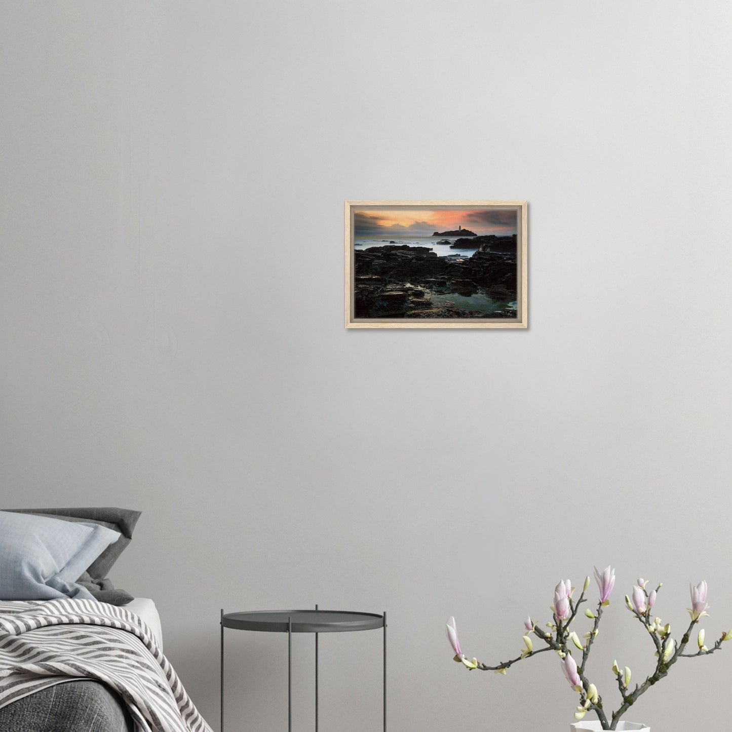 Framed seascape featuring Godrevy Lighthouse at dusk
