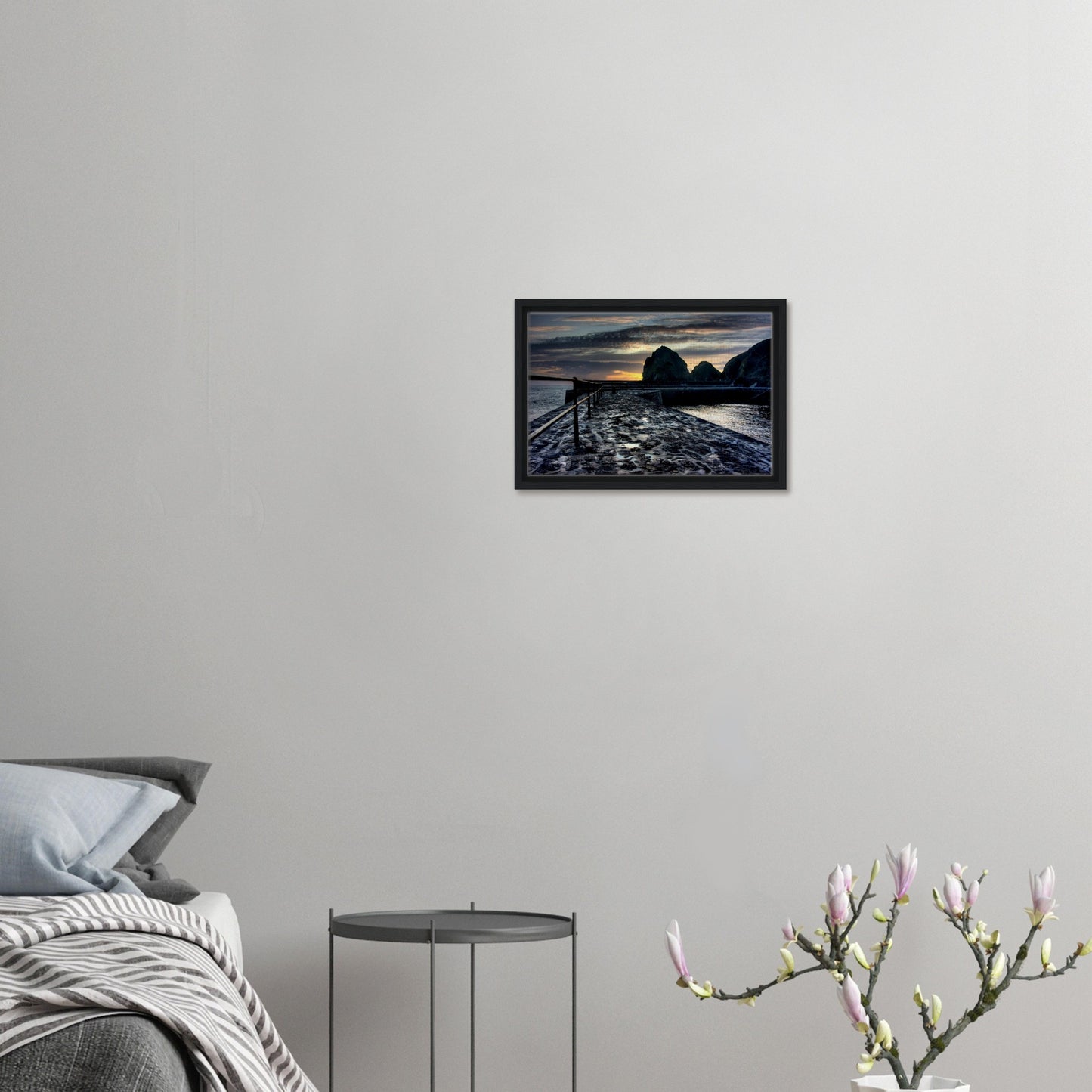 Serene sunset scene in Cornwall with sea spray and rugged coast