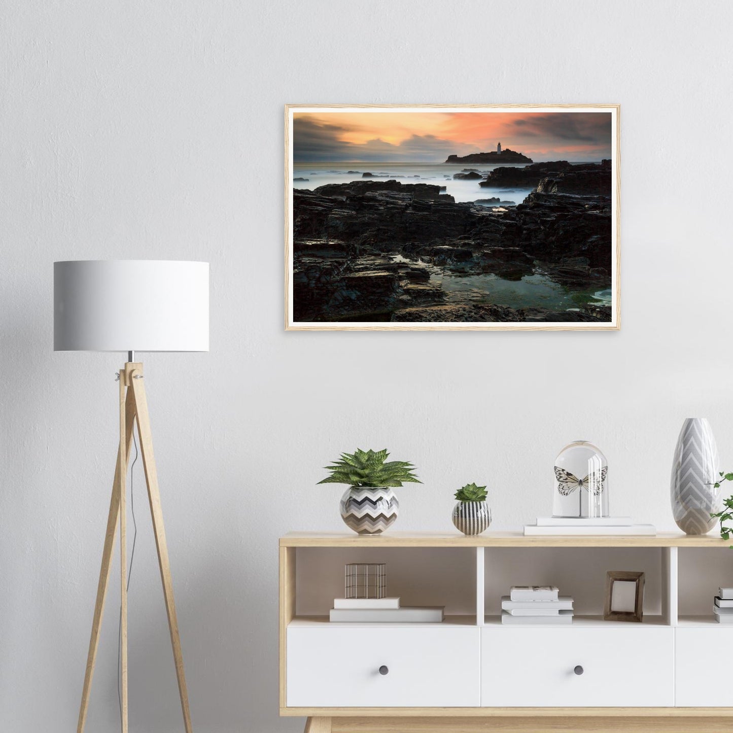 Godrevy Lighthouse framed print with layered rocks and golden light