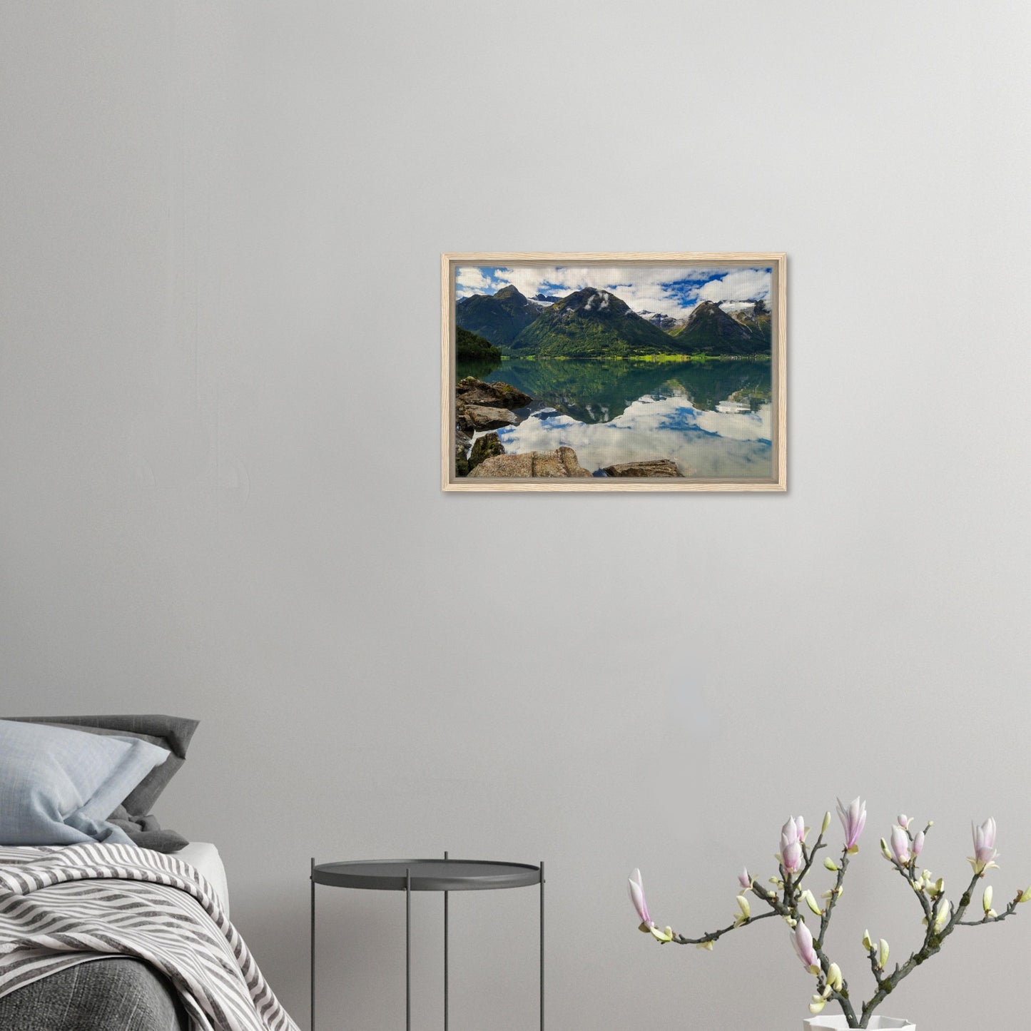 Foreground rocks leading to mirrored lake in scenic artwork