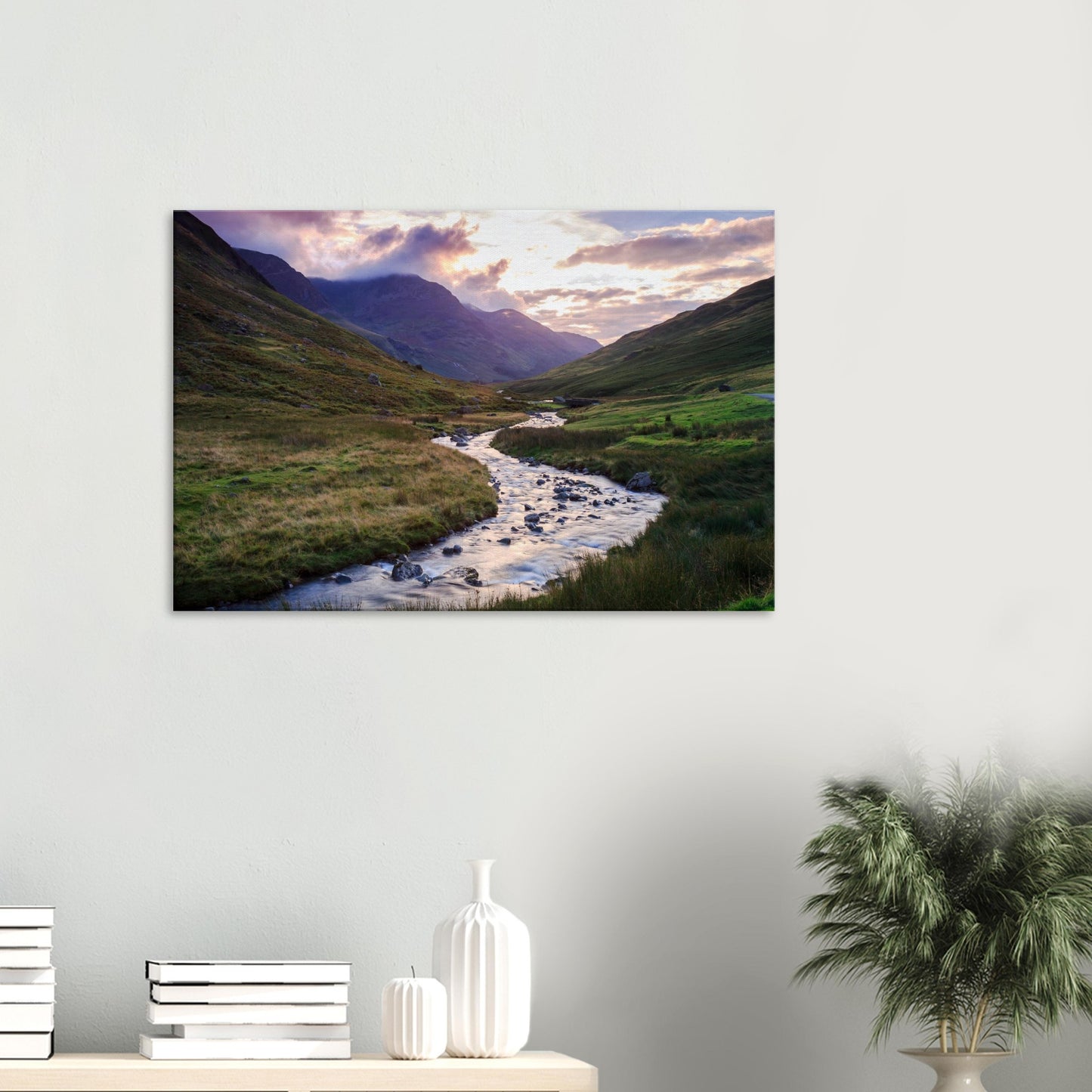 Canvas of Honister Pass capturing the gentle light of golden hour on the valley’s brook and rolling hills beneath cloudy mountains.