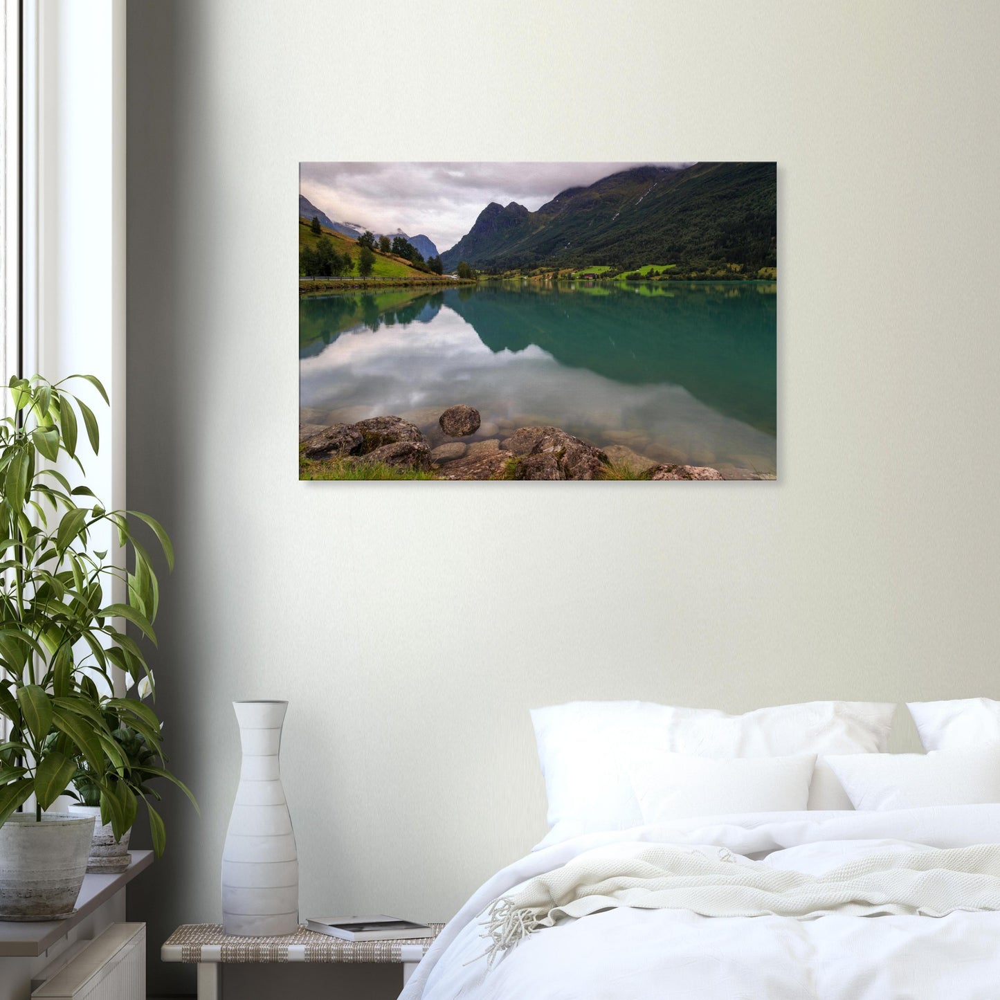Elegant canvas print highlighting the serene atmosphere of Lake Floen with peaceful waters, pebble shoreline, and towering alpine guardians.