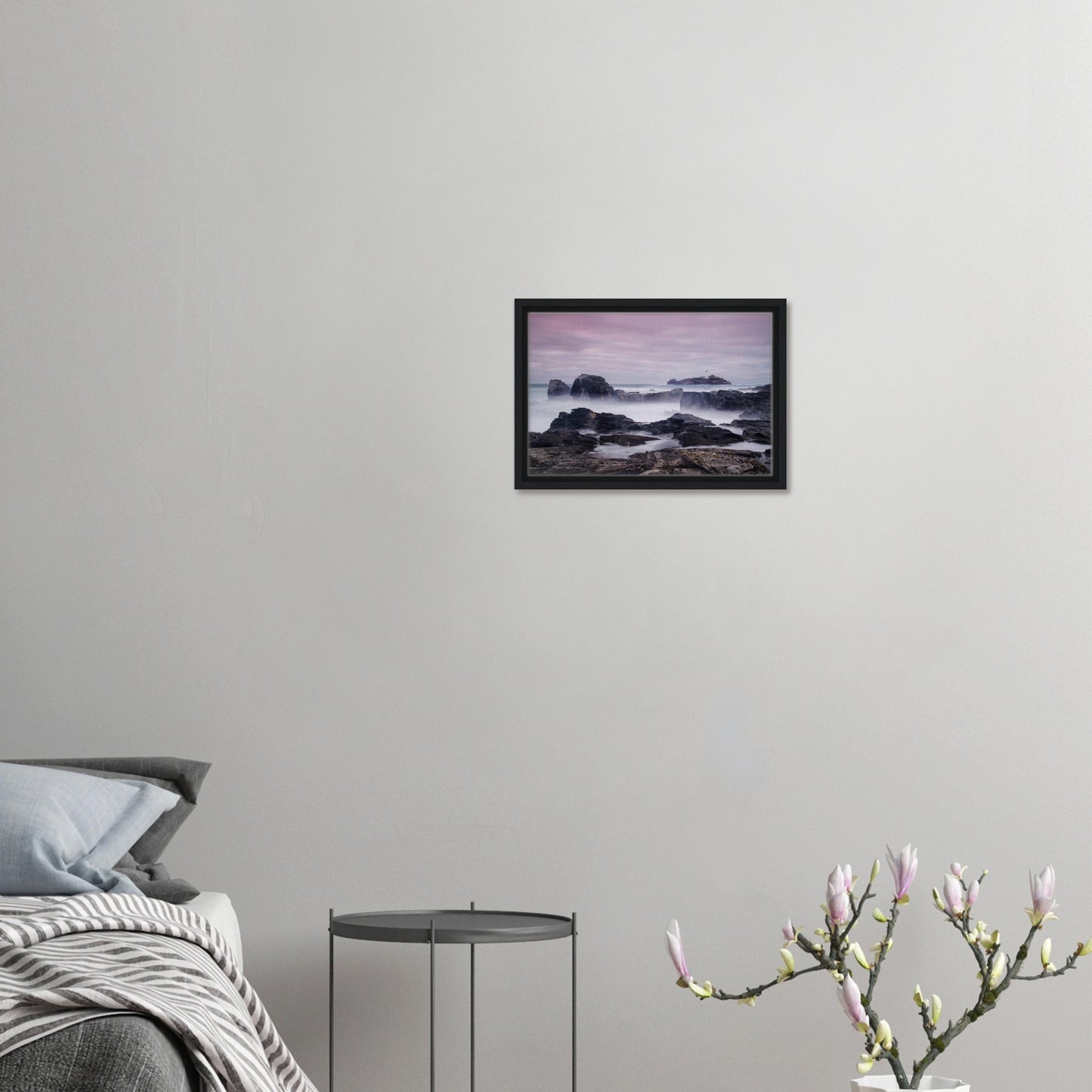 Rugged coastal rocks and calm sea at Godrevy in framed print