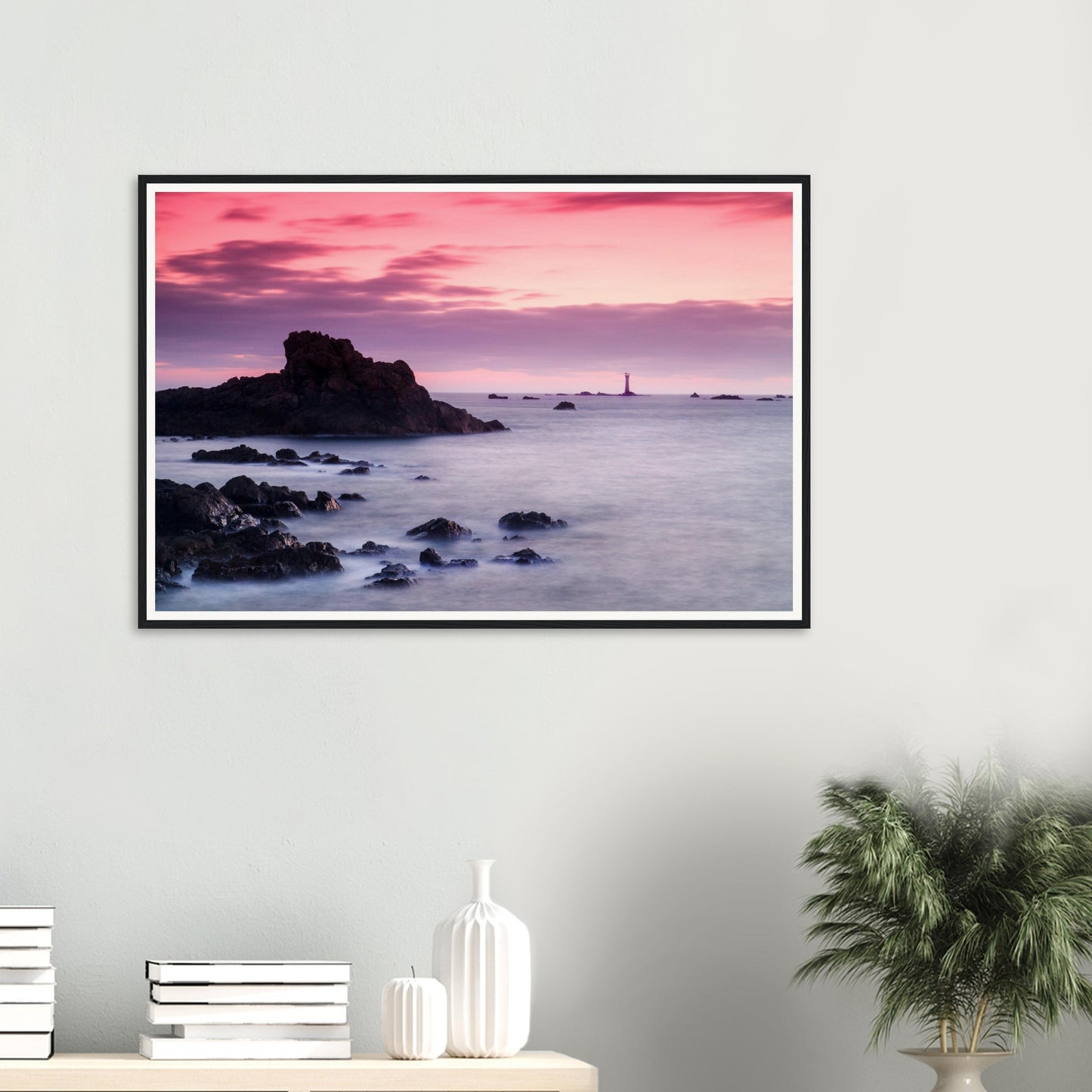 Golden hour framed print of Guernsey coastline and lighthouse