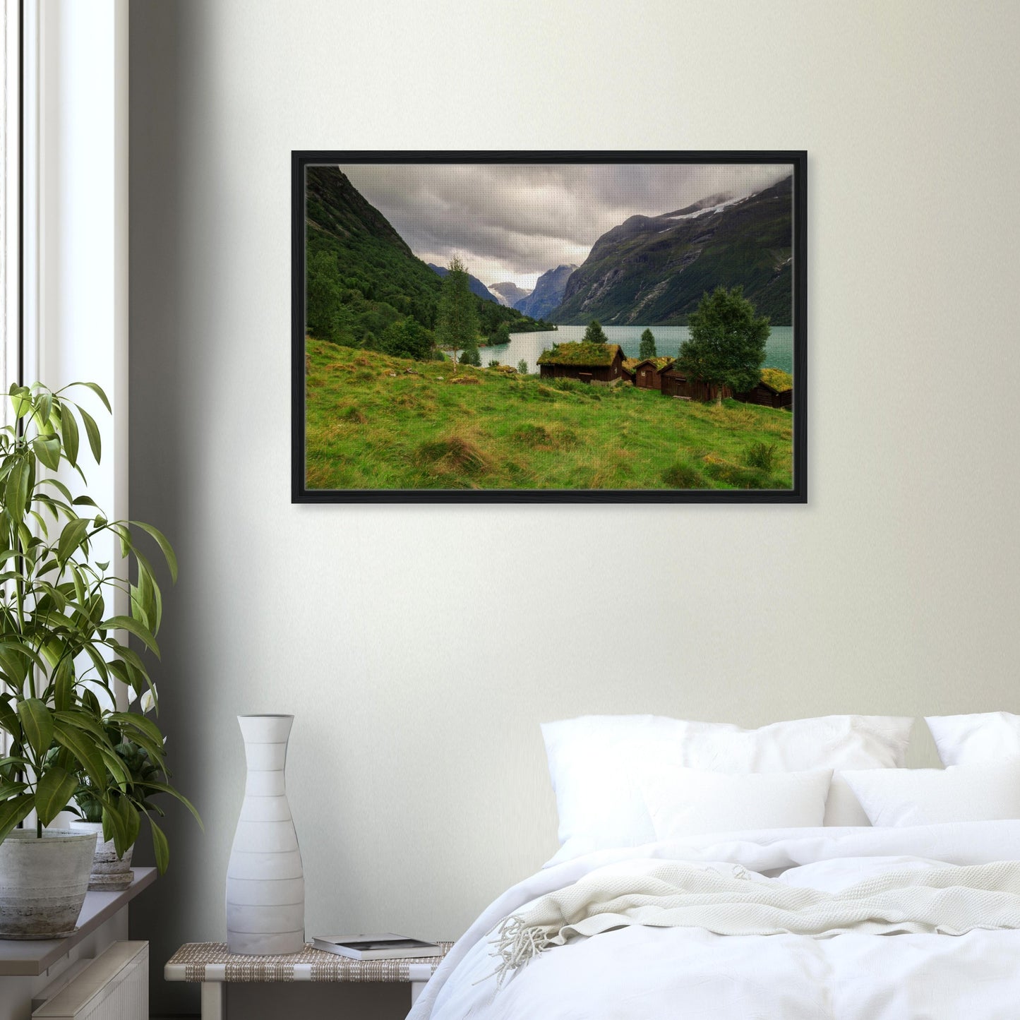 Reflection of cliffs and cabins in calm lake canvas print