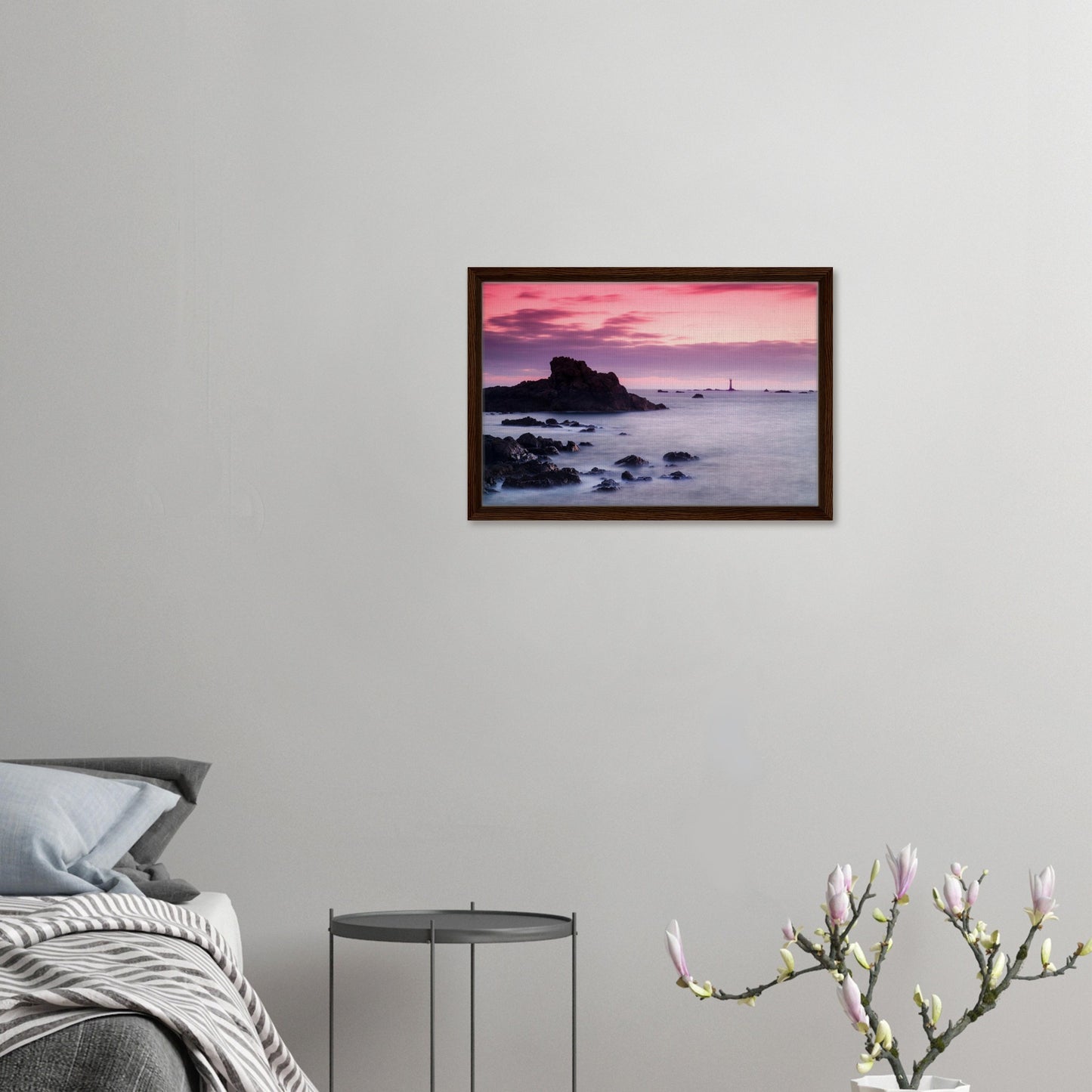 Pastel sunset skies over Guernsey’s coastal lighthouse in frame