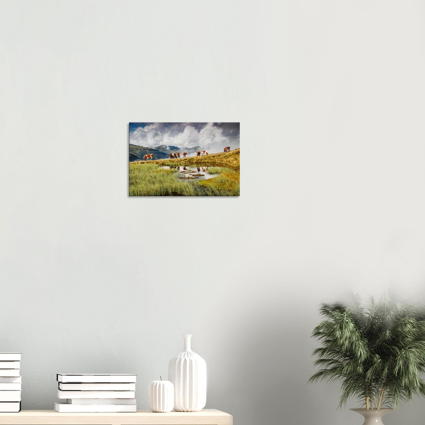 Canvas print capturing the harmony of alpine life with cows, a still pond, and towering Resterhöhe peaks in soft mountain fog.