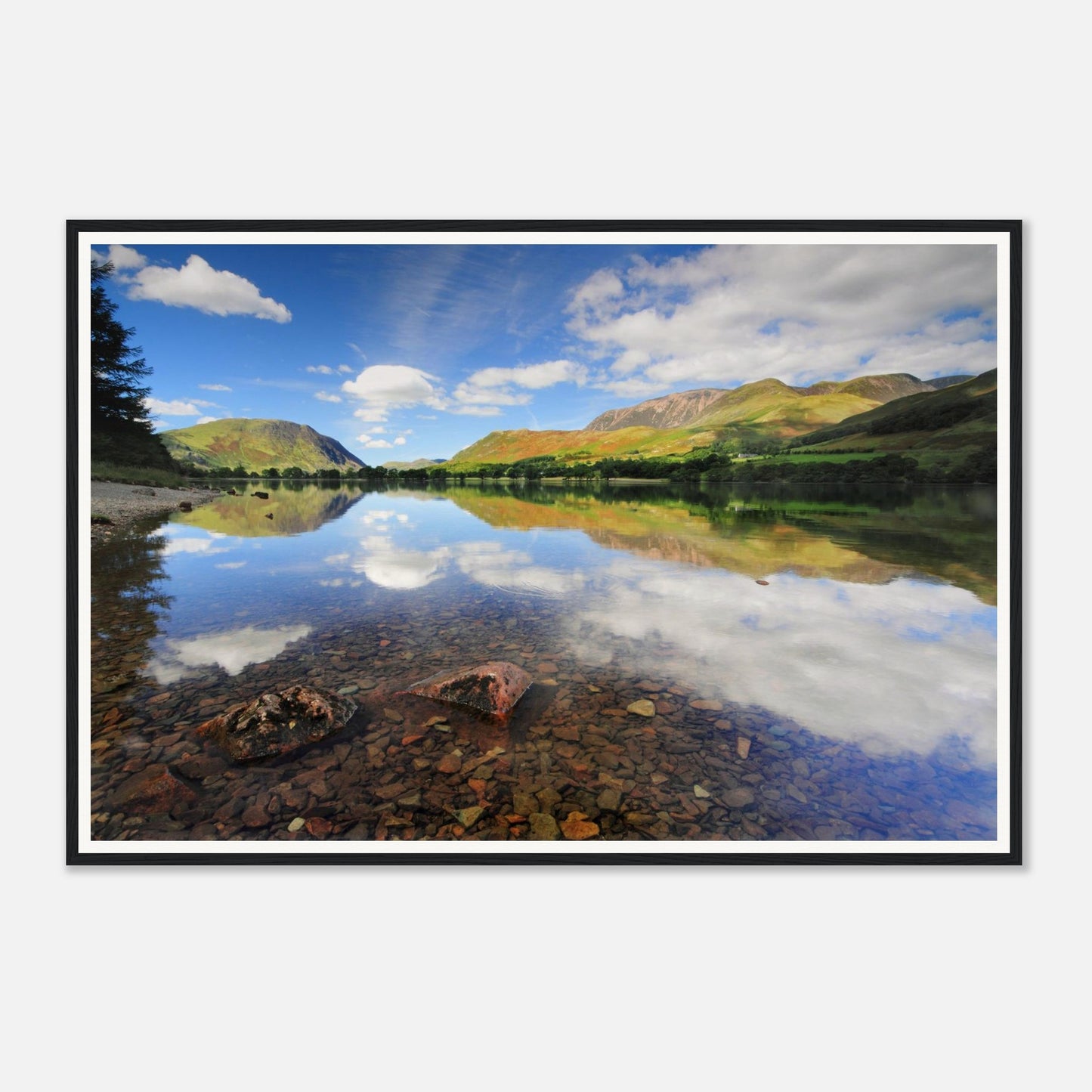 Crystal-clear waters at Buttermere revealing pebbled lakebed