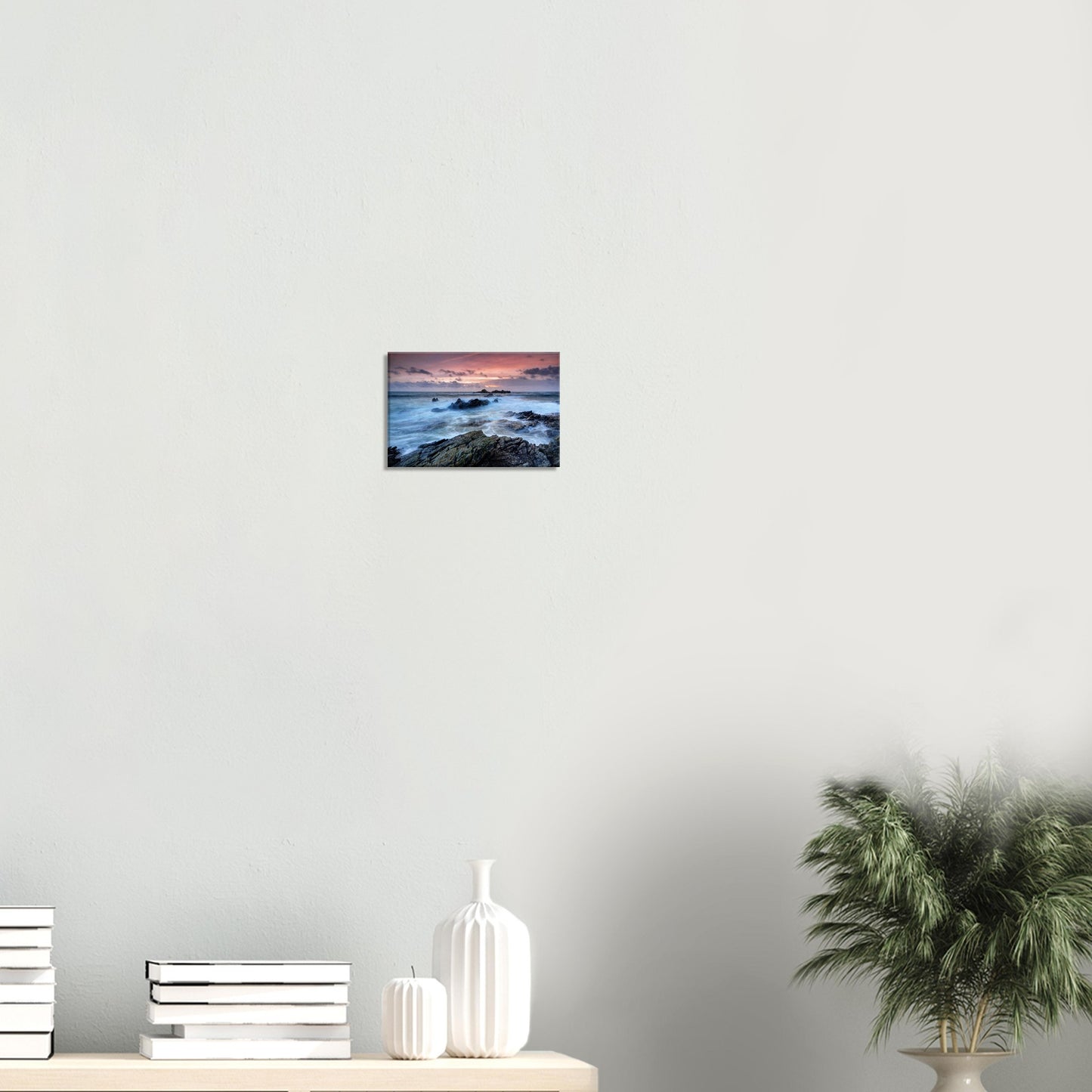 Canvas print illustrating the raw natural energy of Heybrook Bay with motion-filled waves and a vibrant fiery sunset sky.