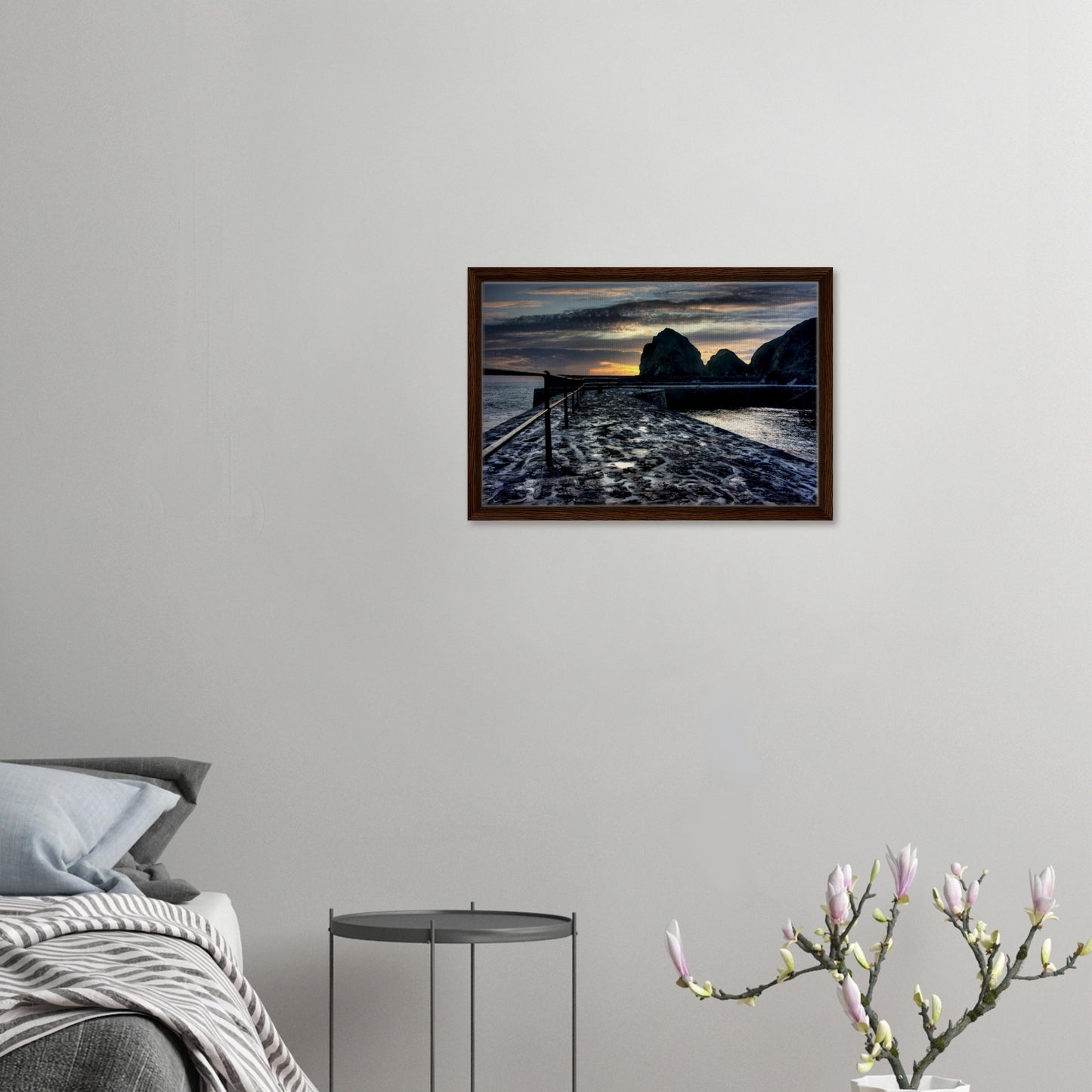 Framed coastal canvas with wet slipway and setting sun
