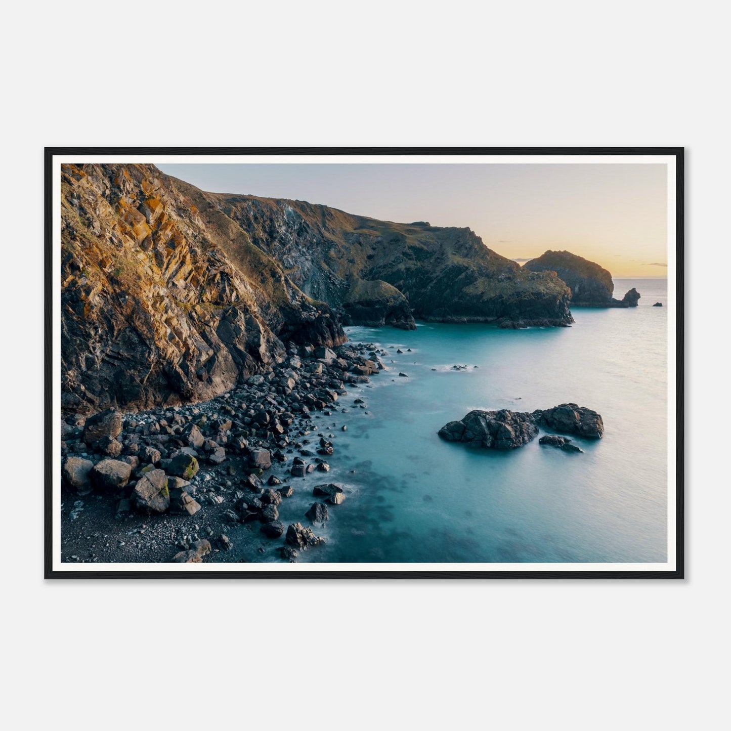 Scenic framed wall art of Mullion Cove in golden hour light
