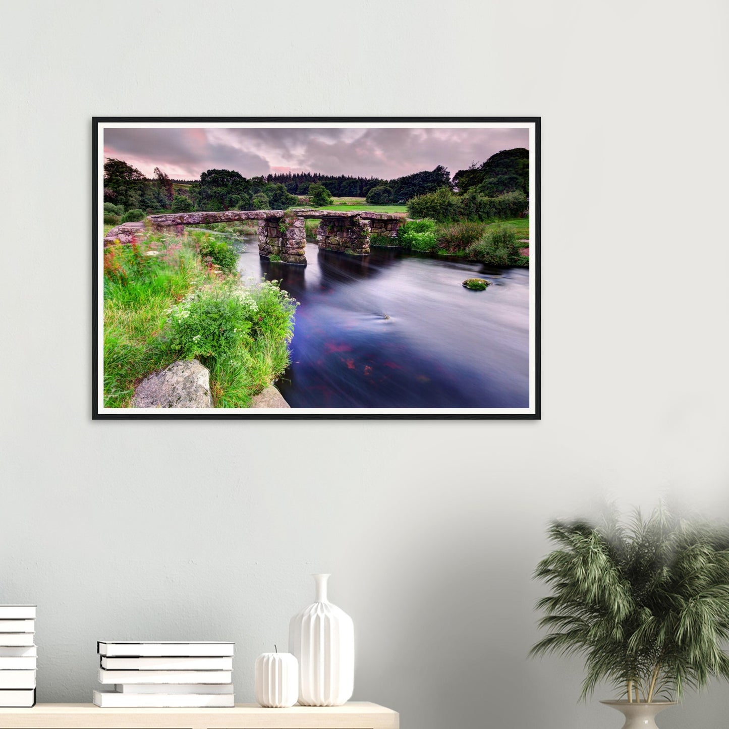 Serene Dartmoor riverside with historic bridge and flowers