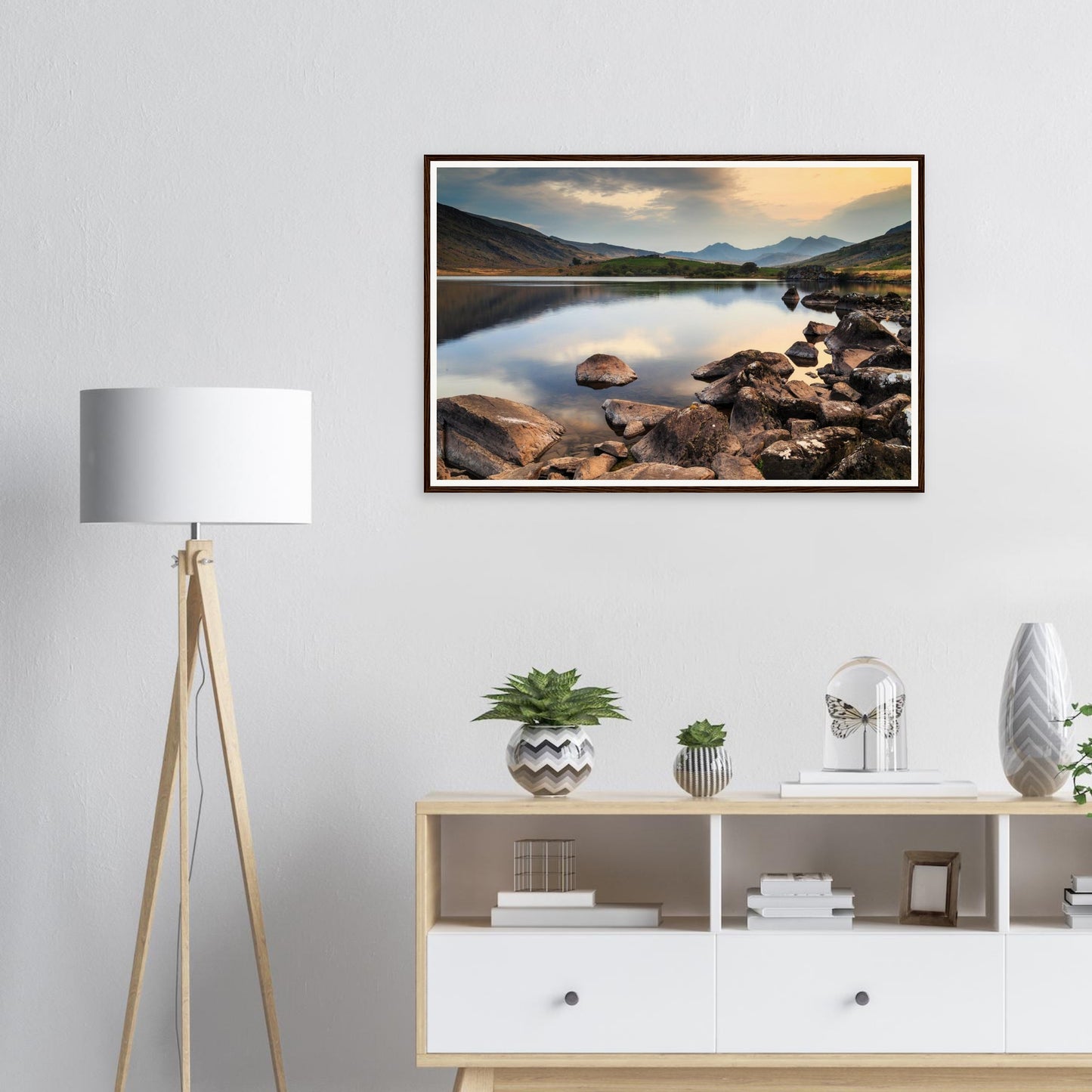 Rocks breaking the surface of Llynnau Mymbyr lake framed art