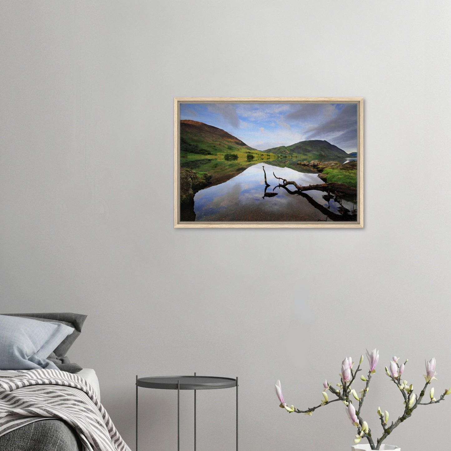 Crummock Water framed landscape with calm lake and branch