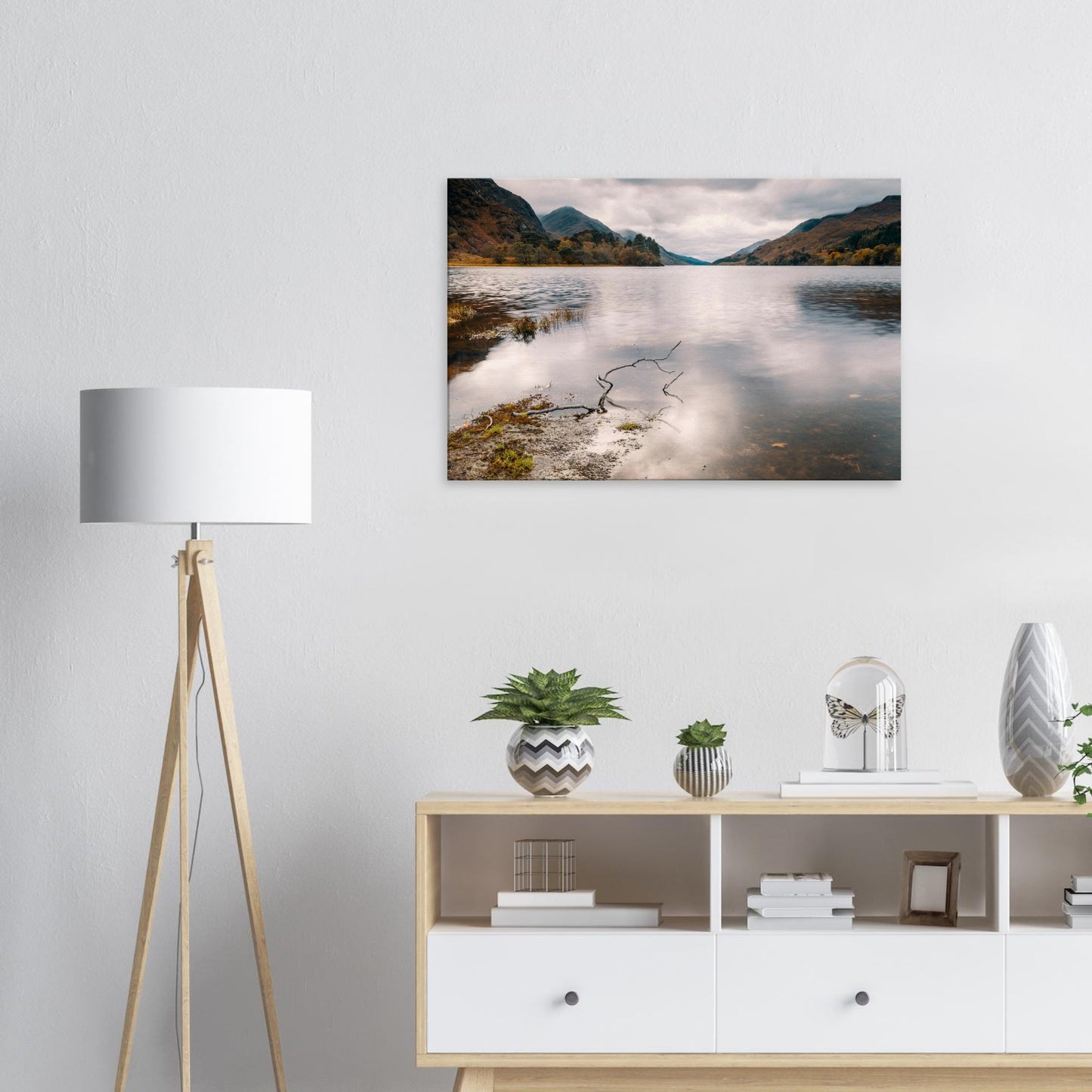 Minimalist nature scene of Loch Shiel with branch on the shore