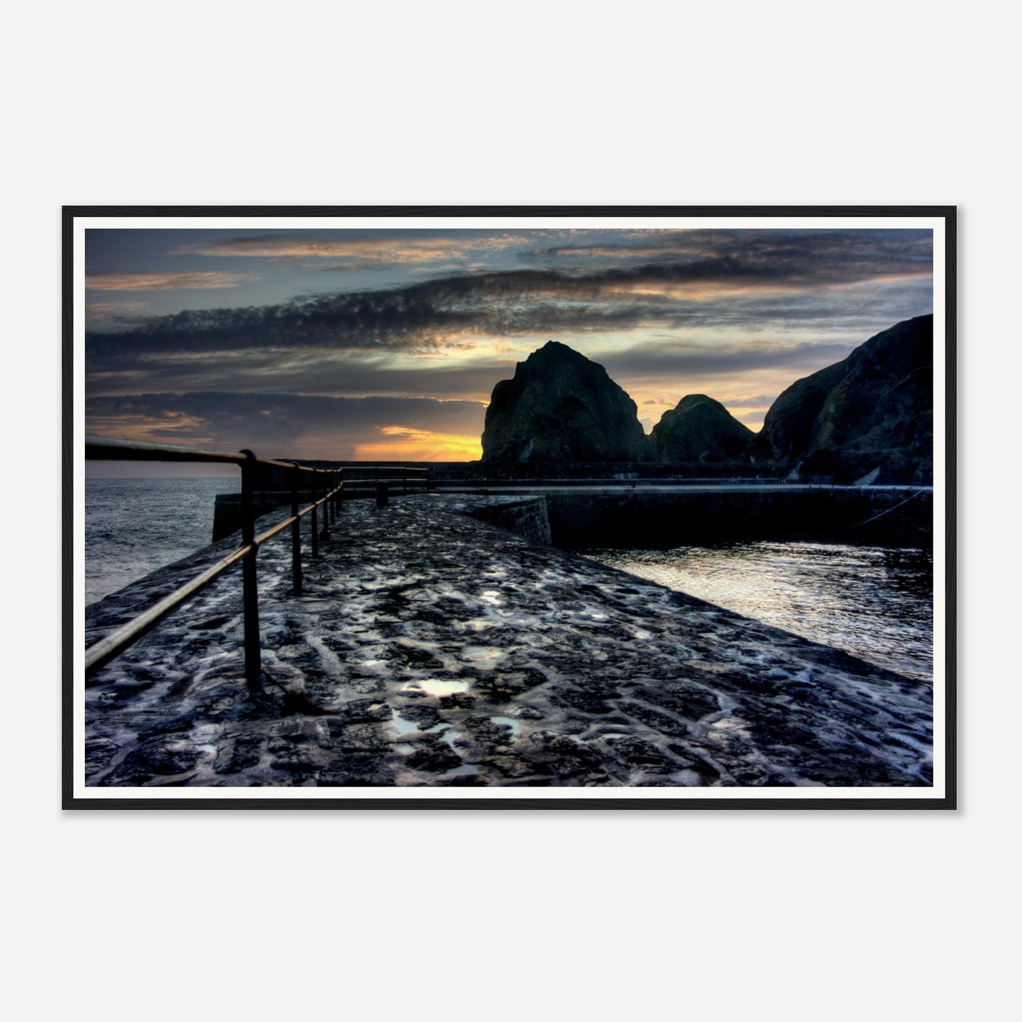 Wet slipway reflecting sunset light at Mullion Cove