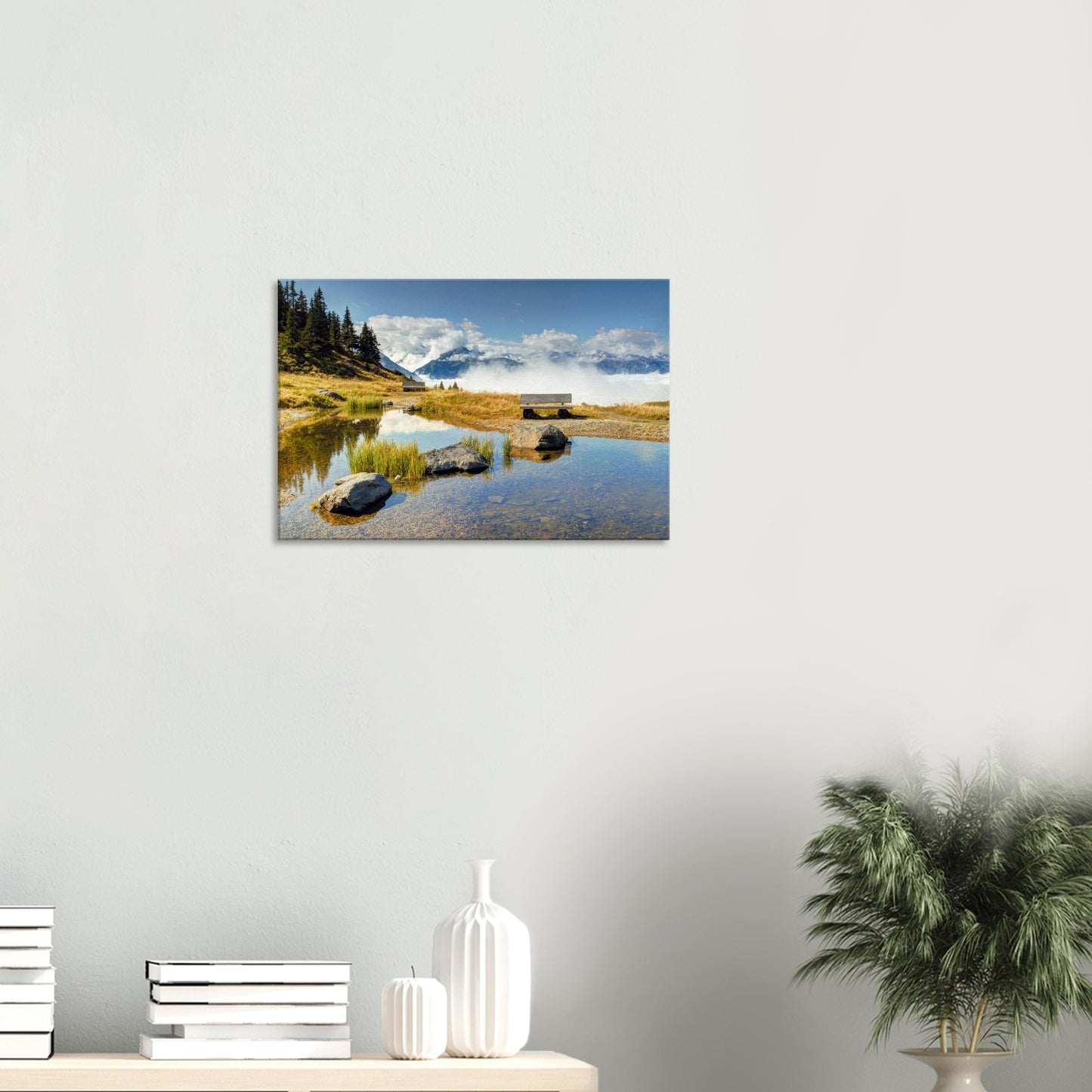 Alpine landscape canvas featuring a calm pond, empty bench, and rolling clouds at the foot of rugged peaks in Resterhöhe.