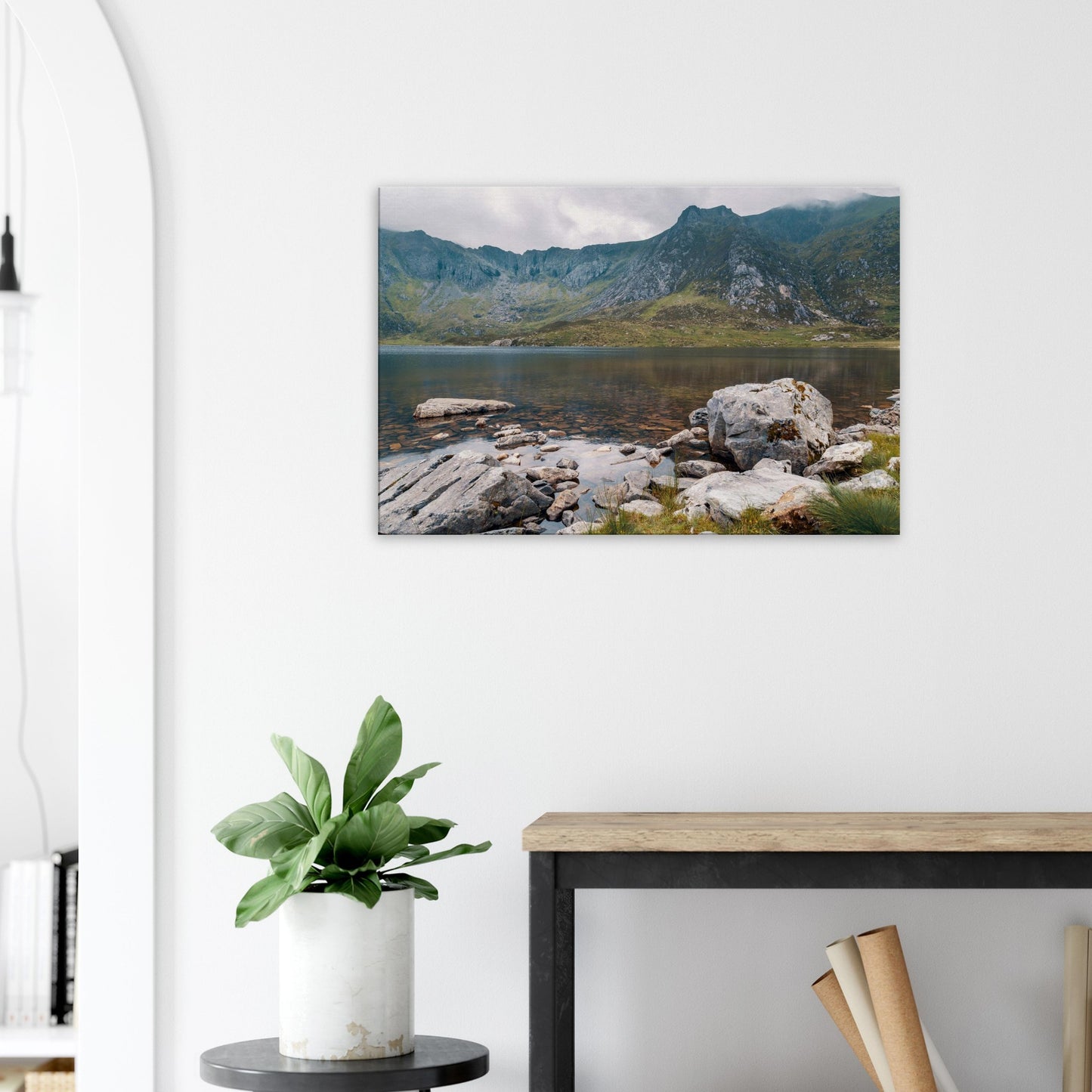 Serene Snowdonia lake view with rocky foreground canvas print