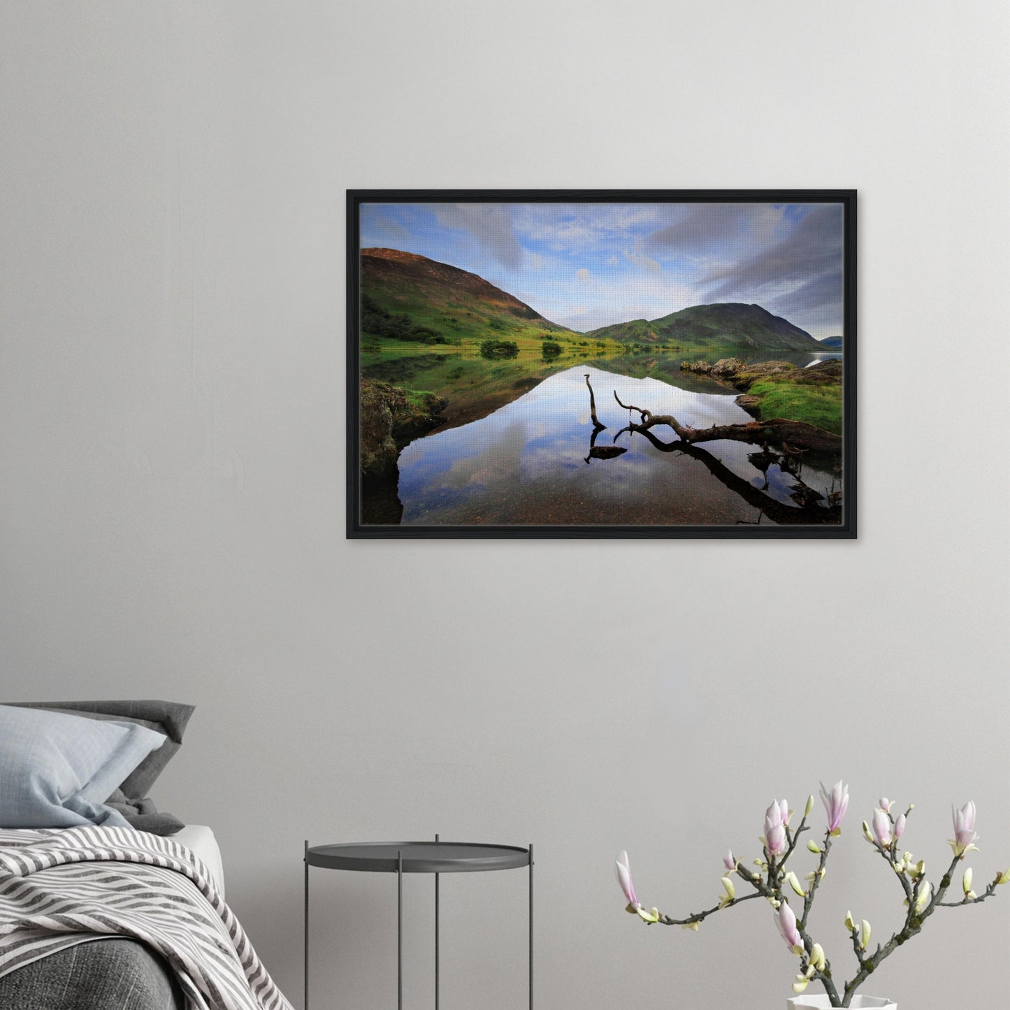Framed canvas print of Crummock Water with branch reflection