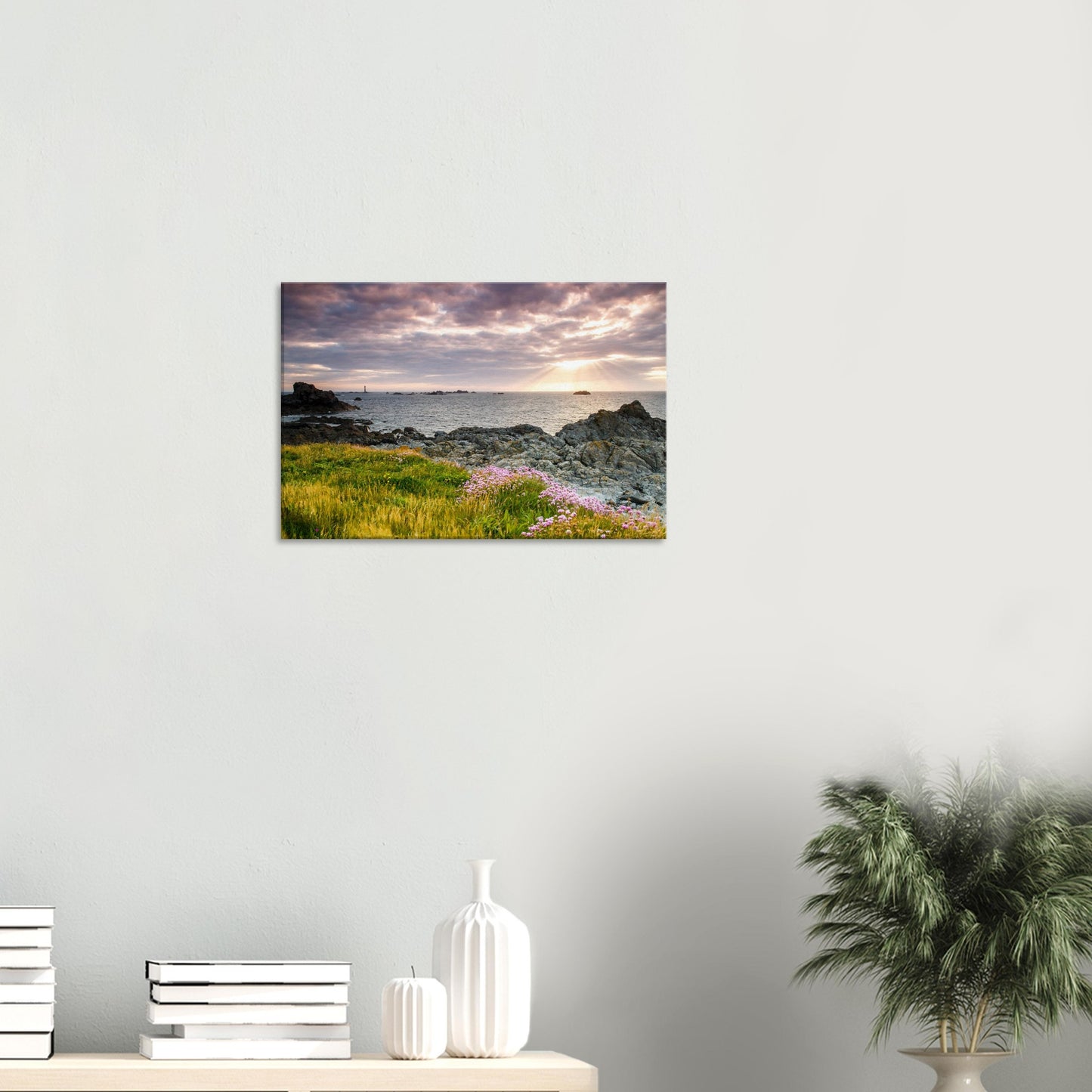 Coastal canvas print of Guernsey with a radiant sunset over Pleinmont Point and the distant silhouette of Les Hanois Lighthouse.