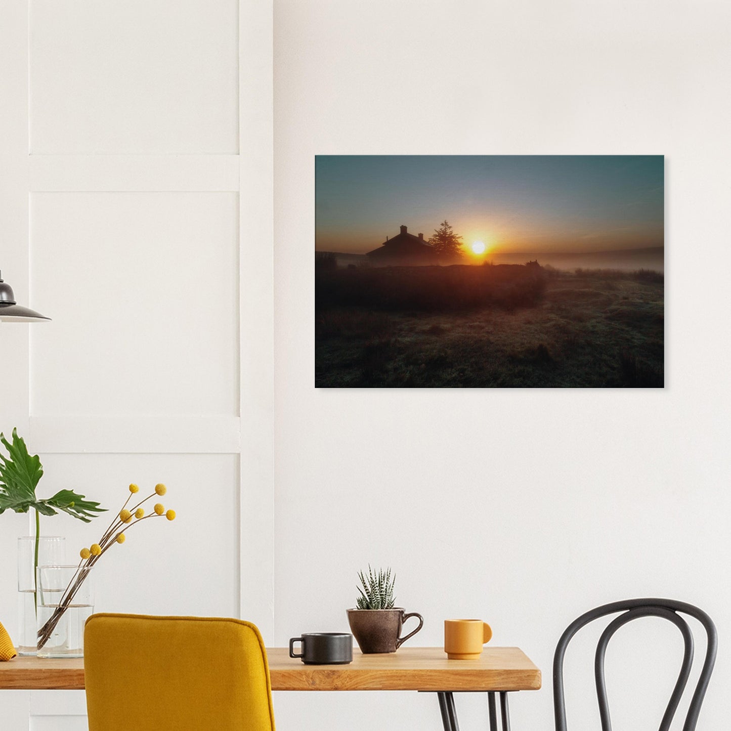 Farmhouse on the moor with golden sunrise and mist in Dartmoor National Park