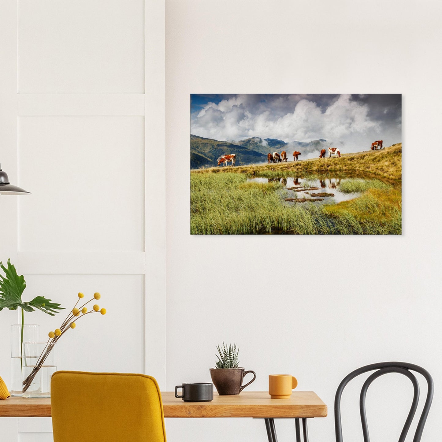Canvas print showcasing alpine tranquillity with cows near a pond and the majestic Resterhöhe range disappearing into the clouds.