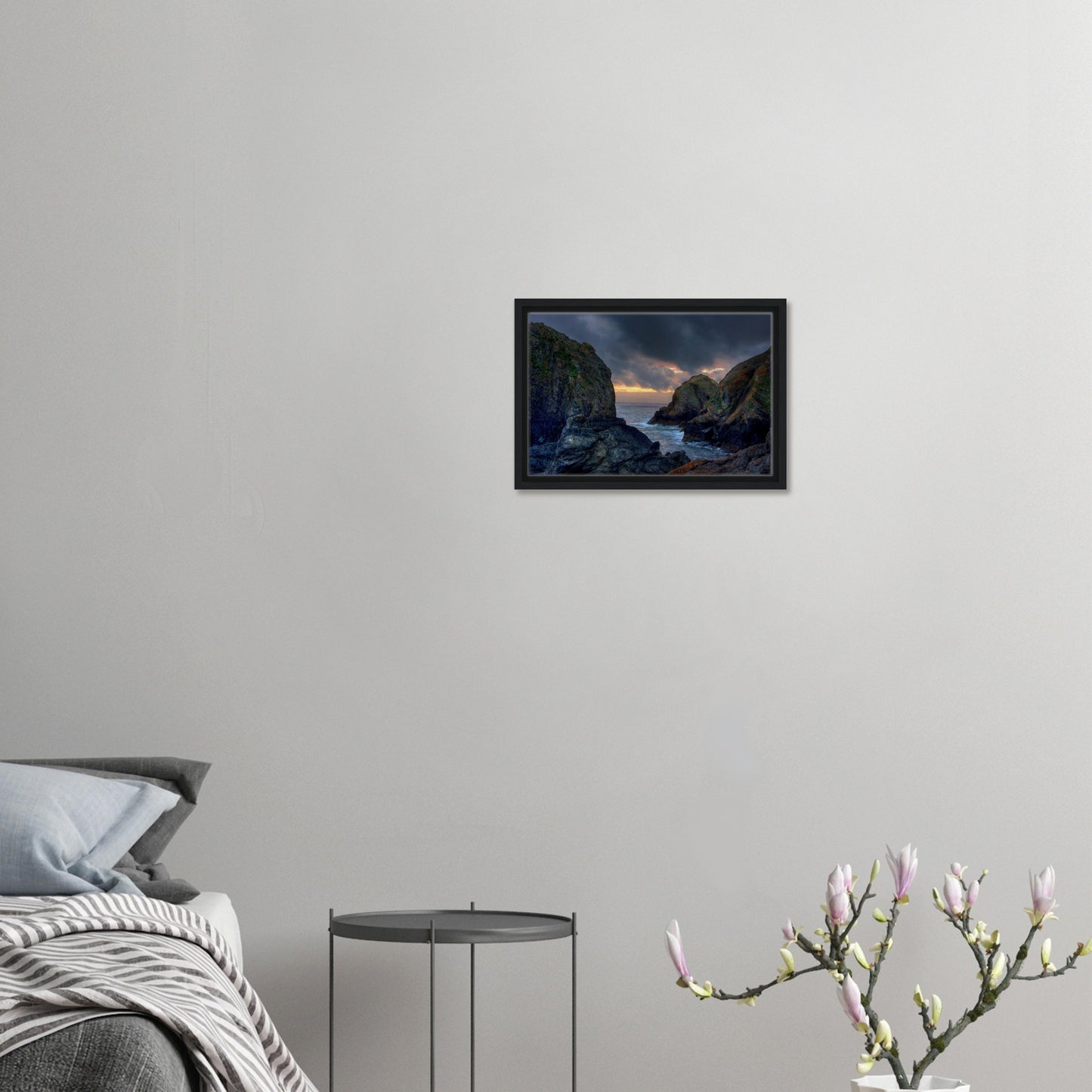 Mullion Cove framed print with dramatic cliffs and warm glow
